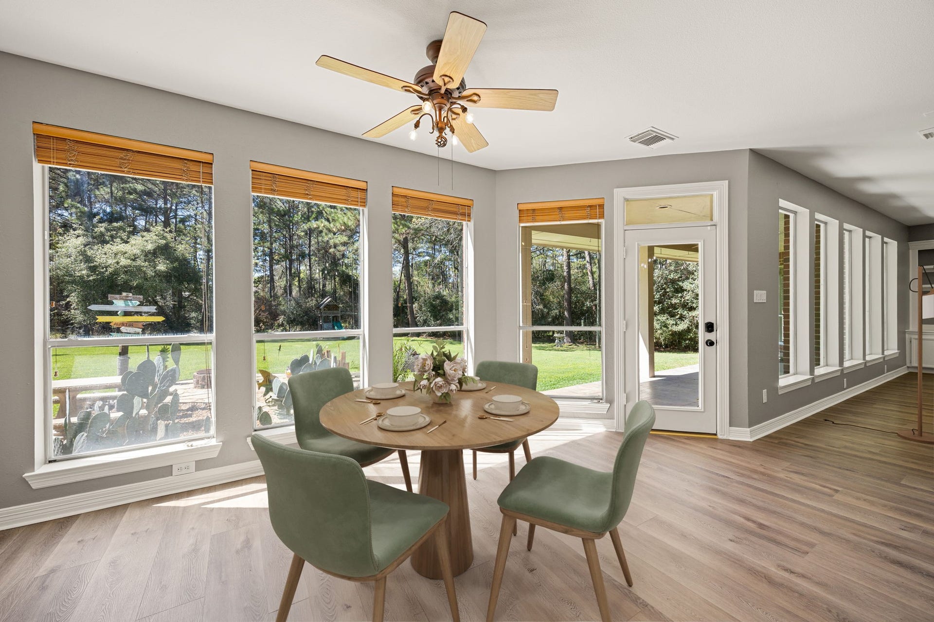 Start your mornings in this bright breakfast area with walls of windows overlooking the backyard, creating a peaceful and relaxing place to enjoy every meal. *virtually staged*