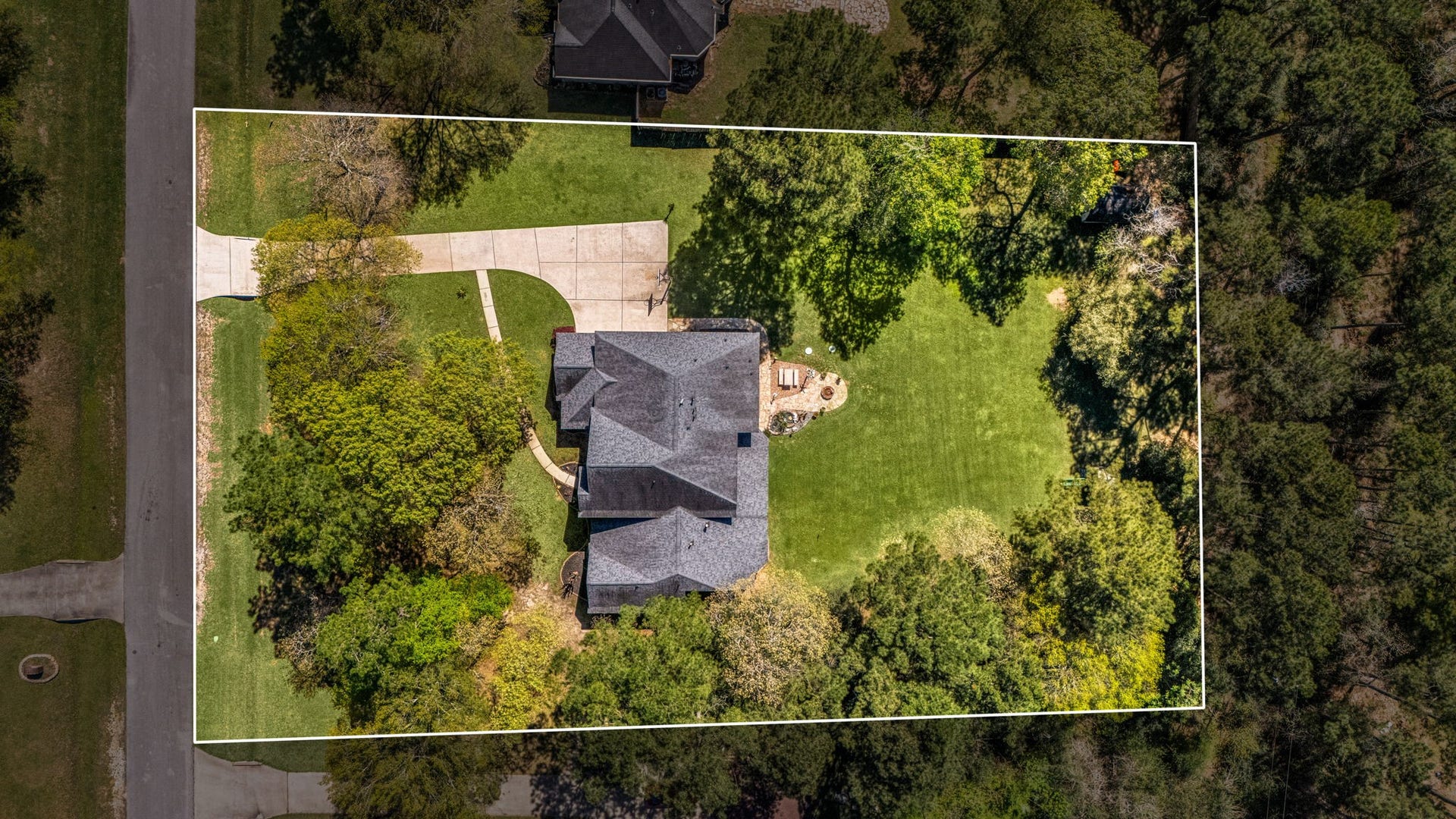 Property lines outlined to highlight the expansive lot, offering privacy, space, and endless possibilities for outdoor living.