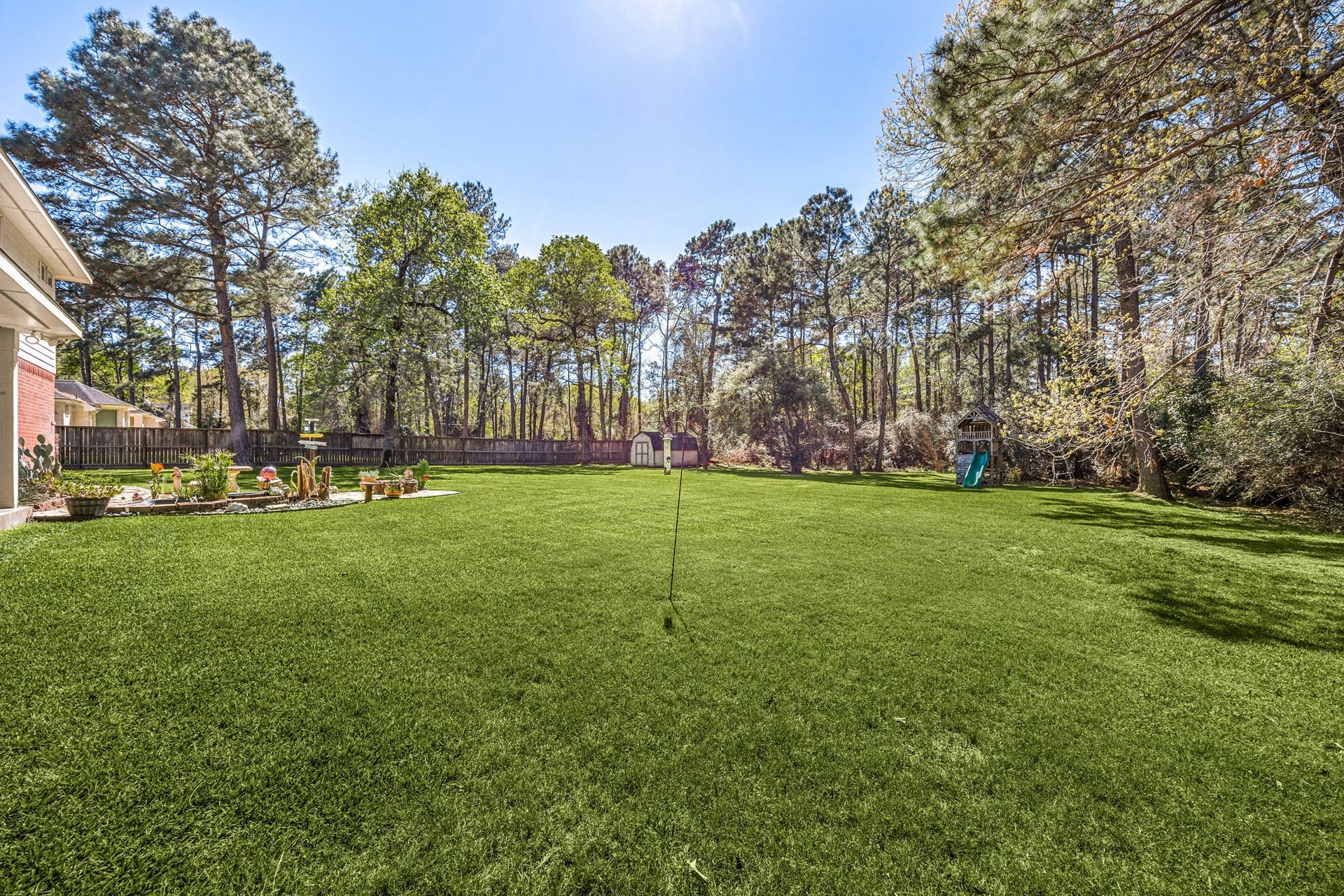 Enjoy the expansive backyard with plenty of green space, mature trees, and room to relax, play, or entertain.
