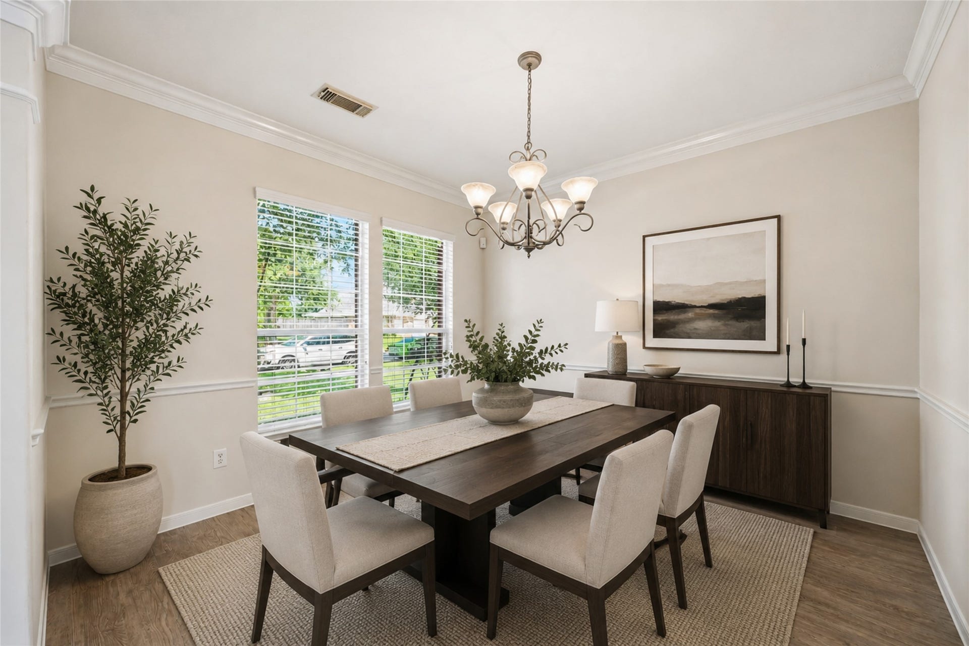 5727 Candlecreek Drive, Richmond, TX 77469 Virtually Staged - A beautiful setting for holiday dinners, celebrations or an intimate evening meal. Natural light and an elegant chandelier help make every gathering feel a little more special.