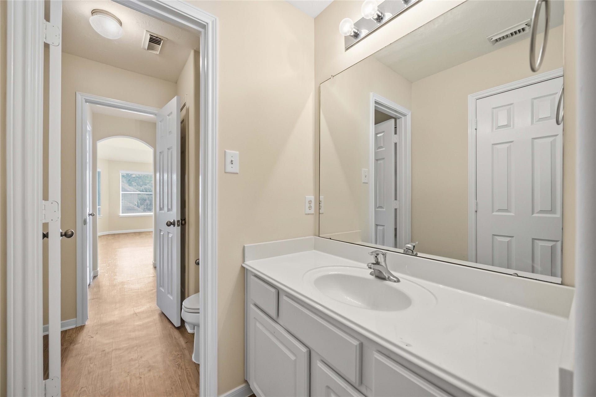 5727 Candlecreek Drive, Richmond, TX 77469 A long vanity provides generous counter space for getting ready without feeling cramped. Storage below helps keep everyday items tucked away.