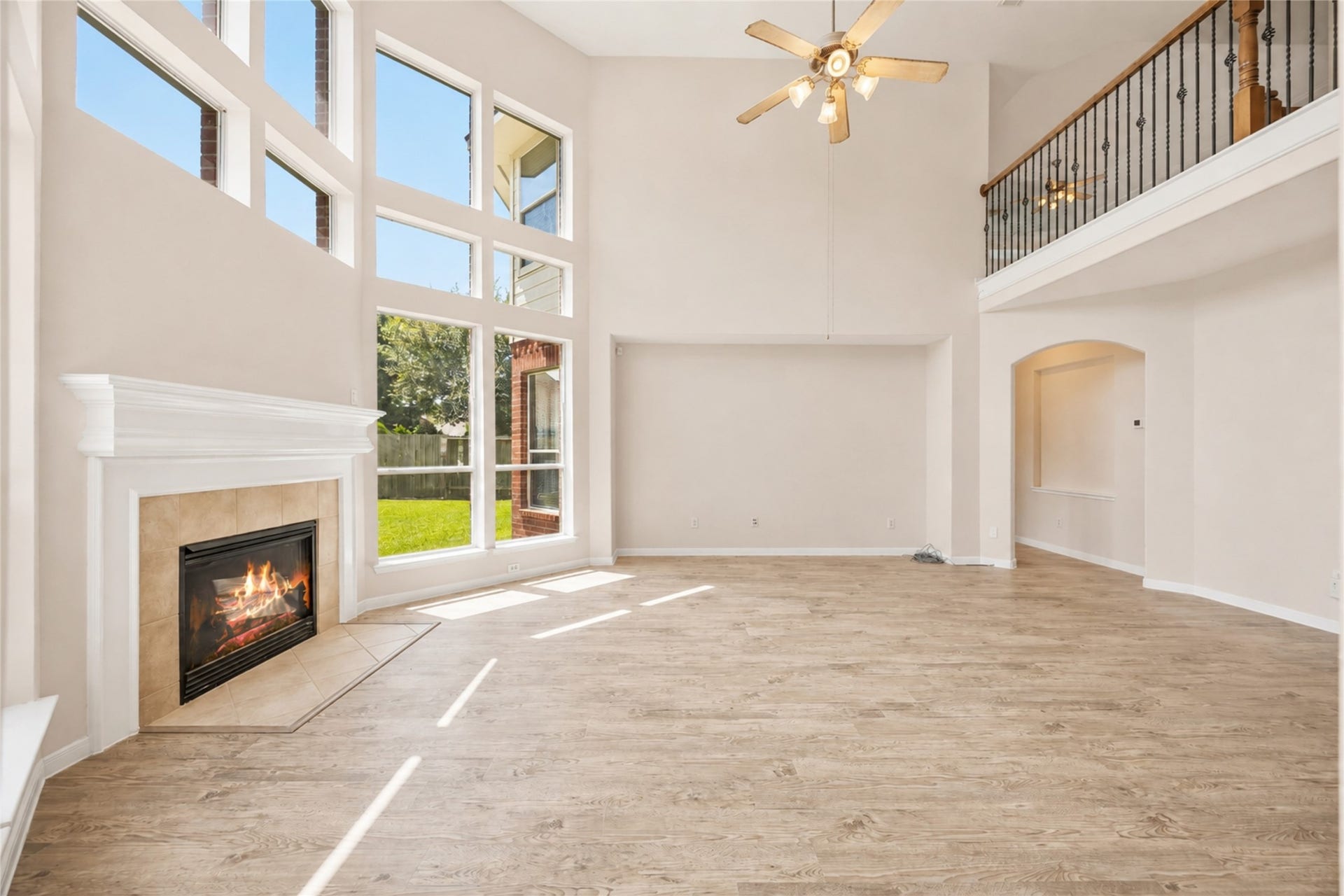 5727 Candlecreek Drive, Richmond, TX 77469 Curl up by the fireplace or enjoy the sunlight pouring through the impressive two-story windows. This is the kind of living space that naturally becomes the heart of the home.