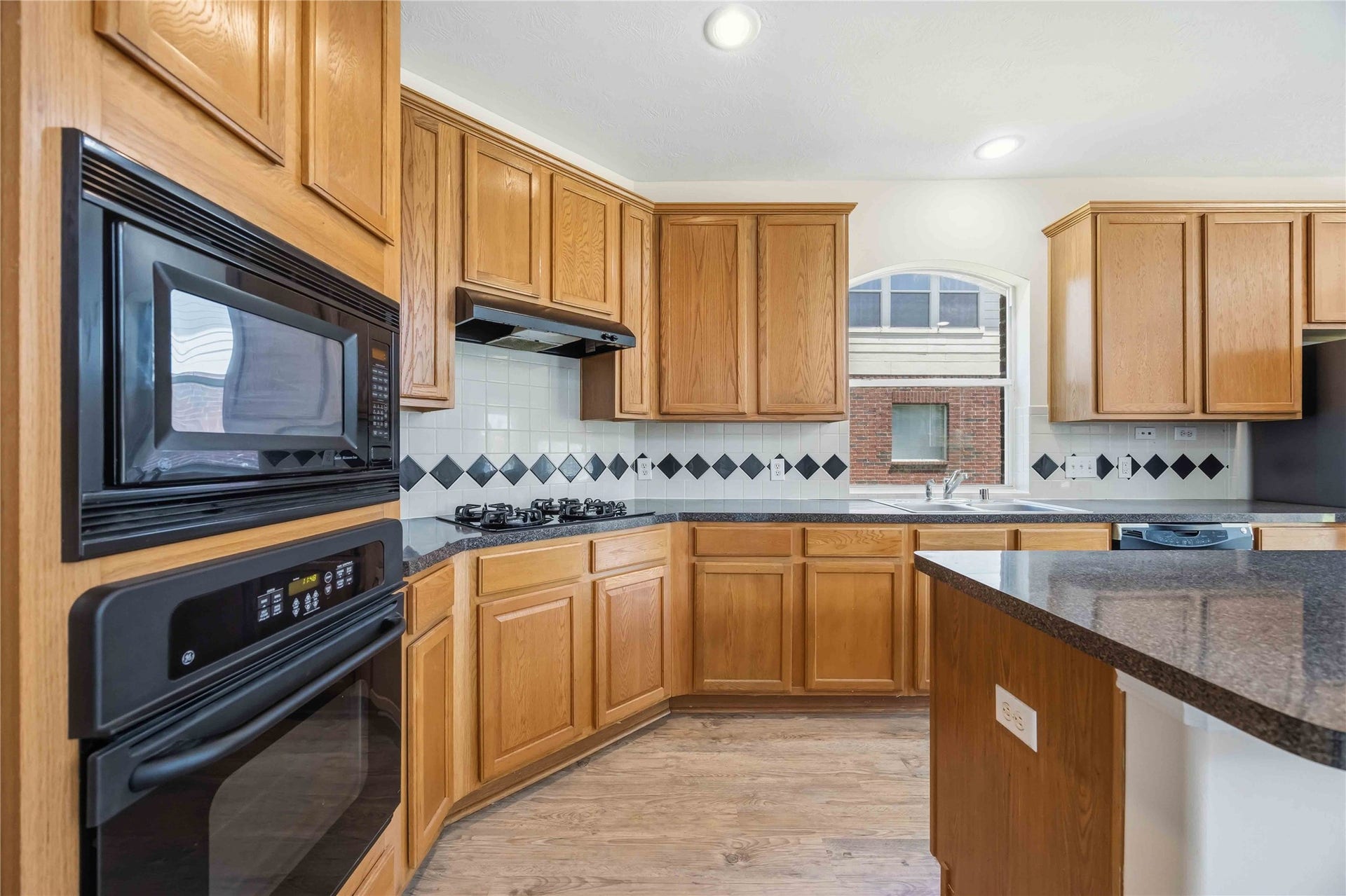 5727 Candlecreek Drive, Richmond, TX 77469 Generous cabinetry and built-in appliances provide a practical workspace for anyone who enjoys cooking or entertaining. Everything has room to stay organized and within reach.