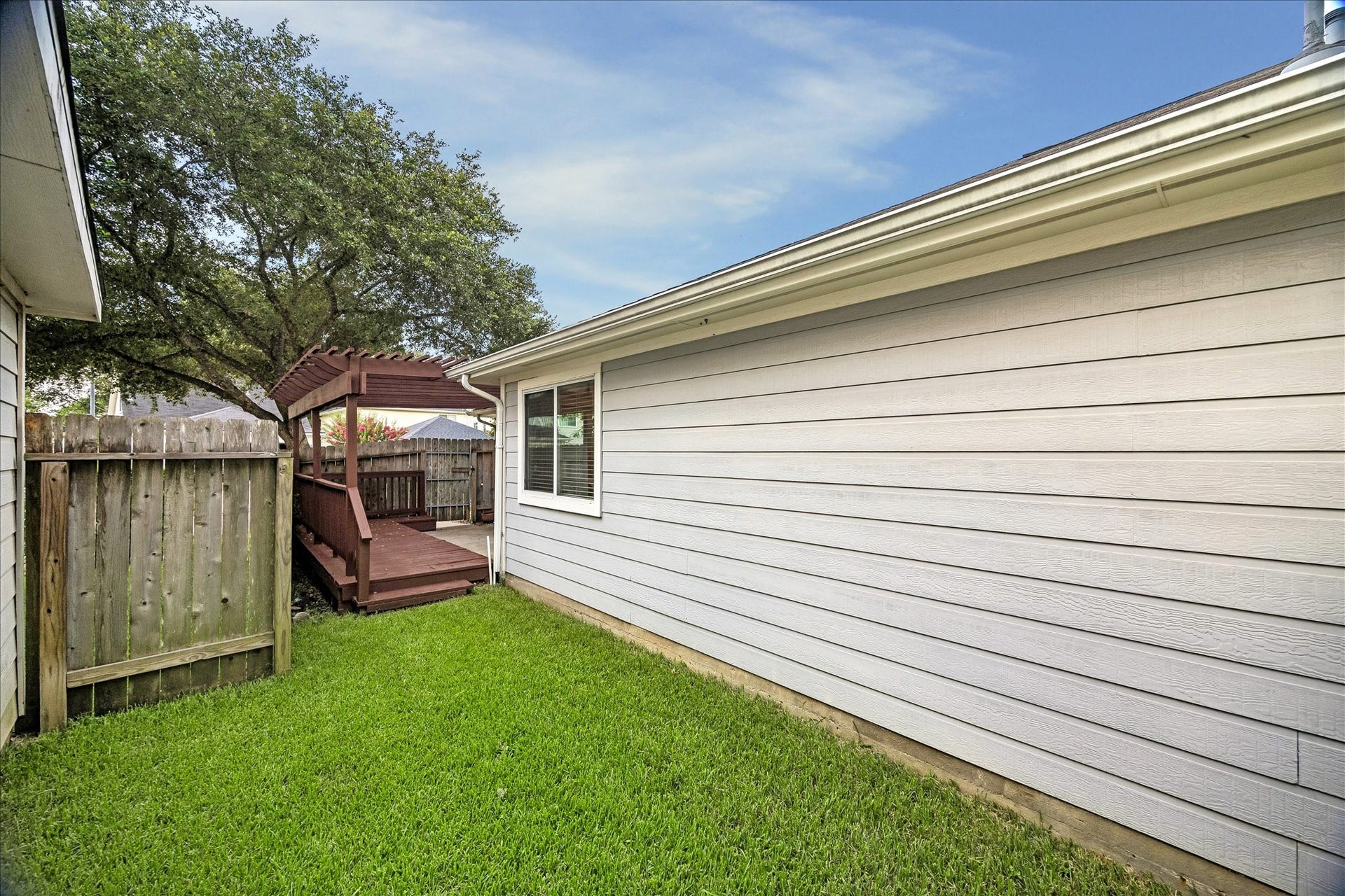 10819 Cobblecreek Way, Missouri City, TX 77459 The fenced yard is easy to enjoy with green space for pets or play, and a deck plus patio ready for your favorite outdoor touches.