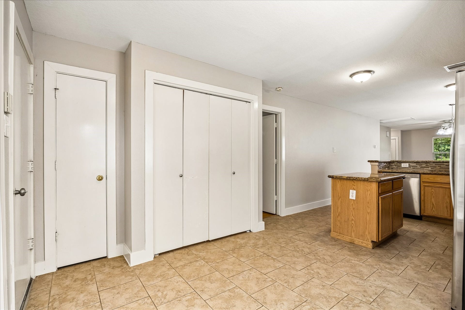 10819 Cobblecreek Way, Missouri City, TX 77459 Folding doors keep the utility area neatly tucked away, while the nearby pantry adds everyday function right where you need it.