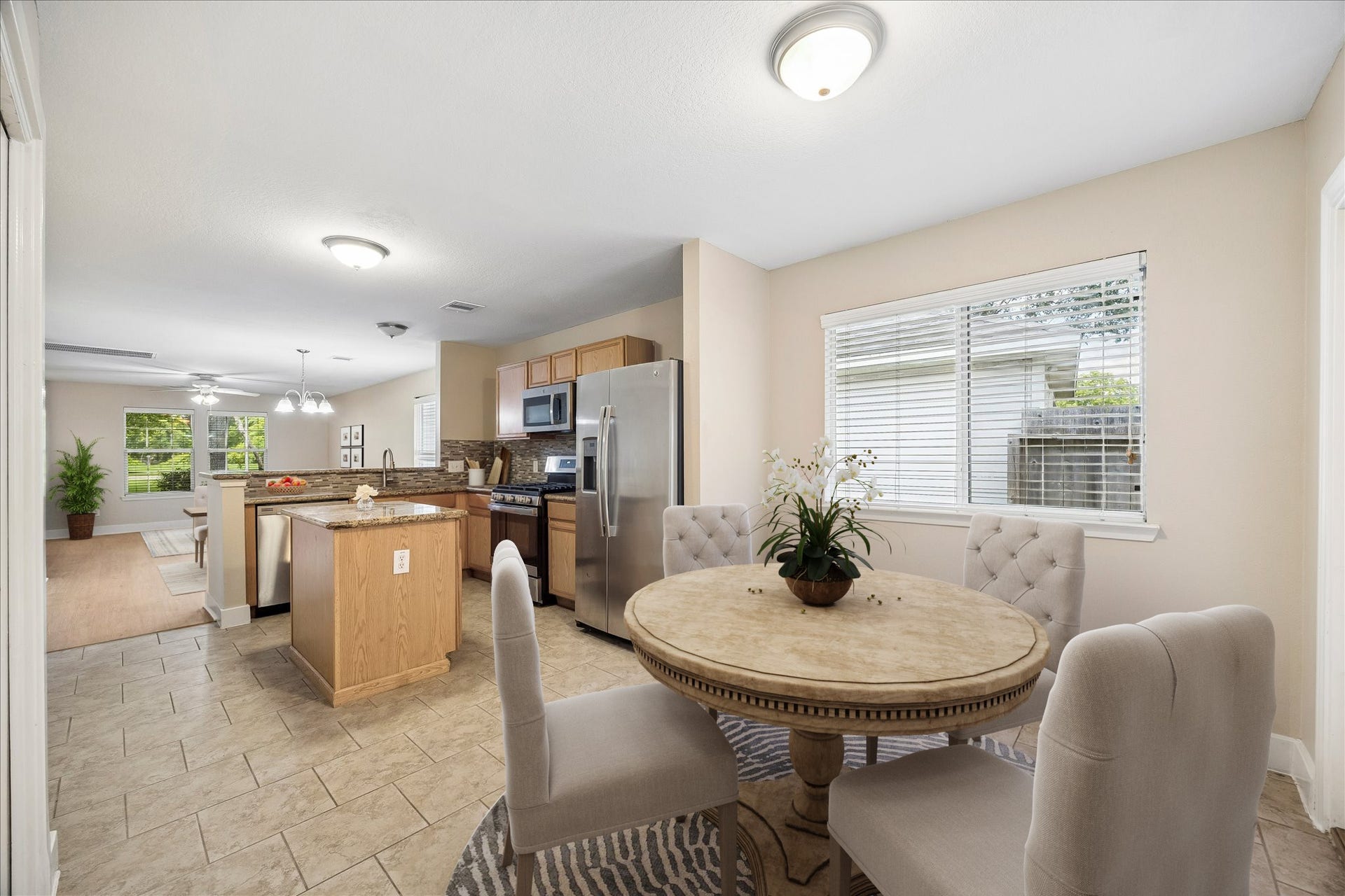 10819 Cobblecreek Way, Missouri City, TX 77459 The eat-in kitchen has tile flooring throughout and plenty of room for a breakfast table, giving you a sunny everyday dining spot for morning coffee, casual meals, and conversations that linger long after the dishes are cleared.
