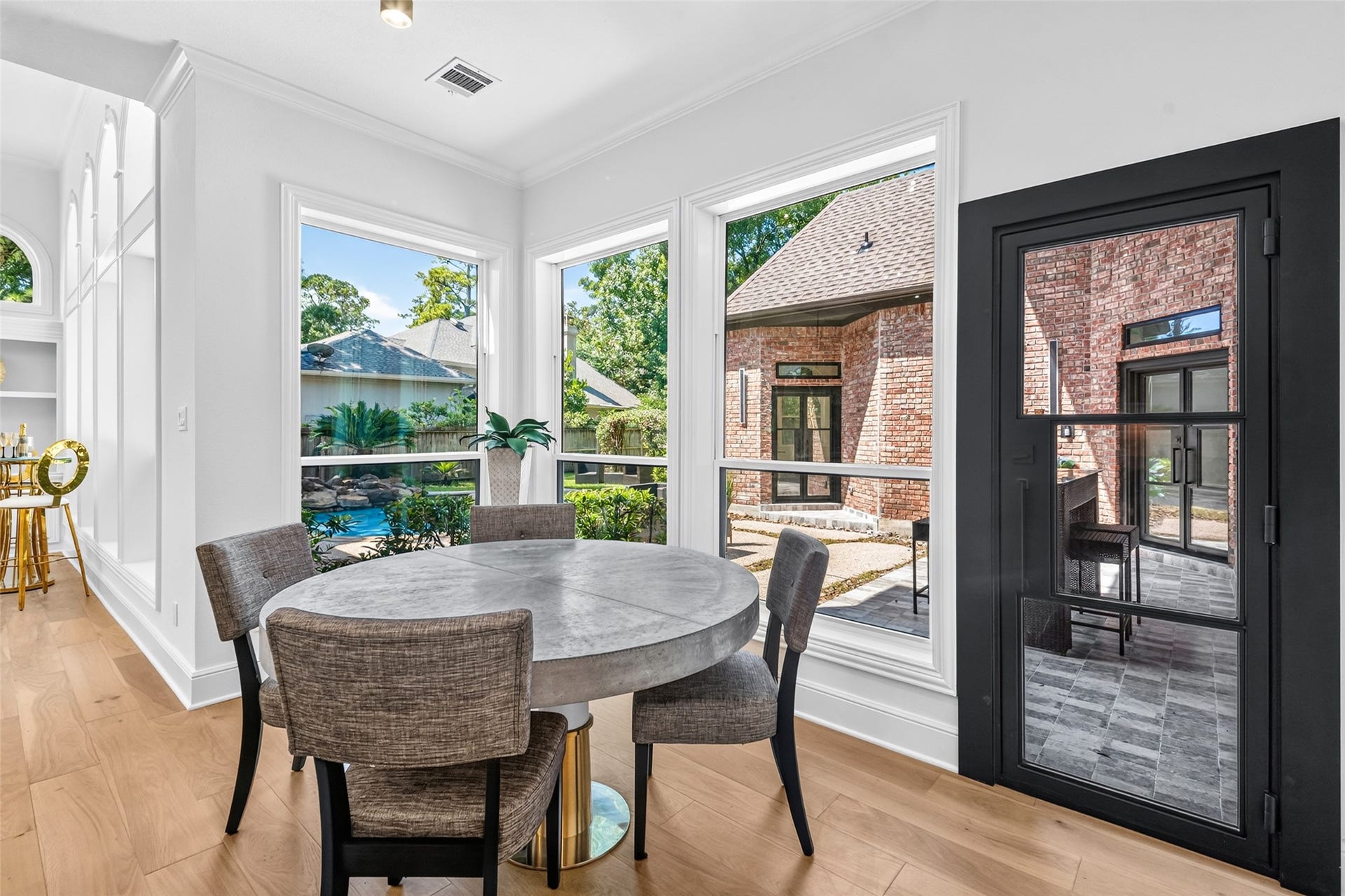 46 Pebble Cove Drive, The Woodlands, TX 77381 Breakfast area overlooks the pool