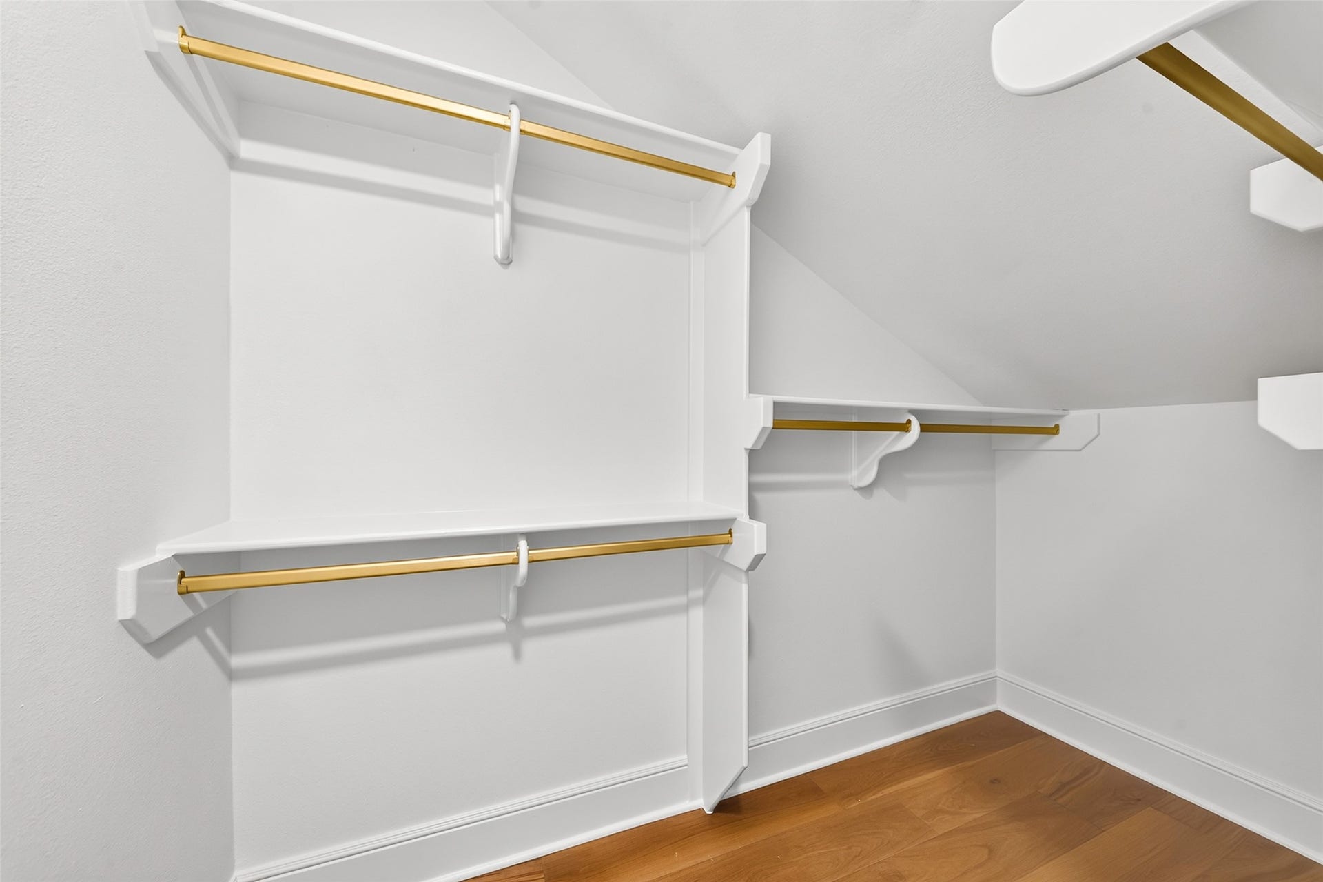 46 Pebble Cove Drive, The Woodlands, TX 77381 Abundant closet space with elegant gold accents offers both style and practicality, perfect for all your storage needs.