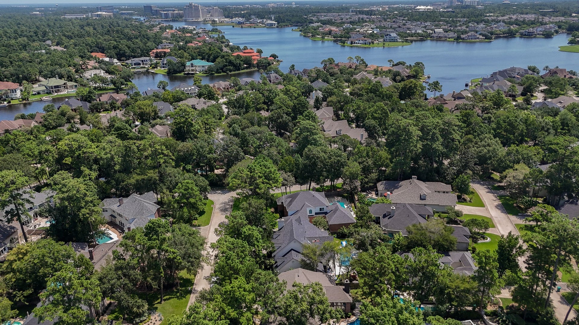 46 Pebble Cove Drive, The Woodlands, TX 77381 The Cove...close to the water. This is the drone view from the home.