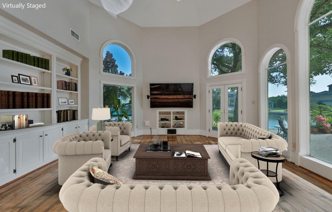 35 W Isle Place, The Woodlands, TX 77381 Spacious family room featuring floor-to-ceiling windows, and a cozy fireplace.