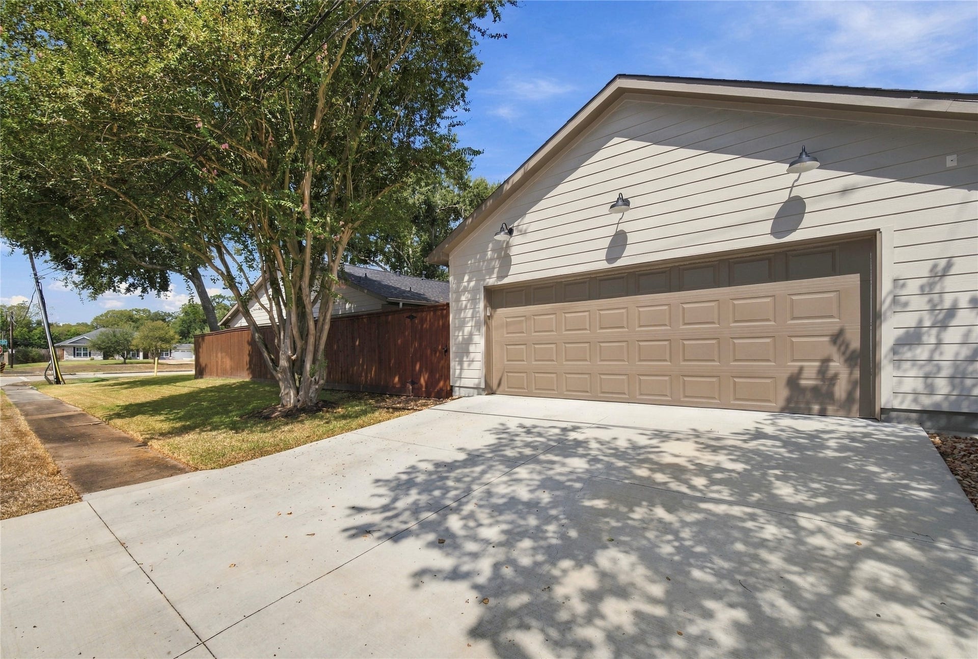 Side view of property with oversized garage