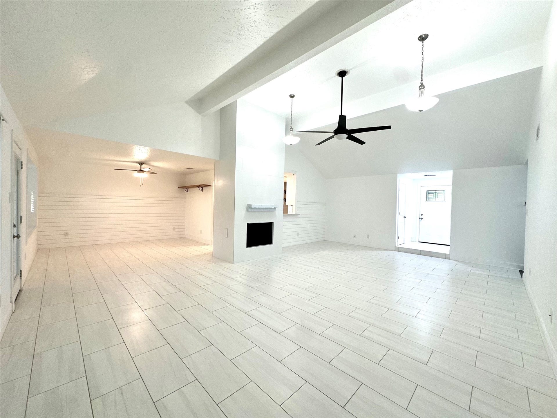 3411 Cannon Ridge Drive, Richmond, TX 77406 Bright and airy room with light tiled flooring, a ceiling fan, and ample natural light from large windows, offering a cozy and inviting atmosphere.