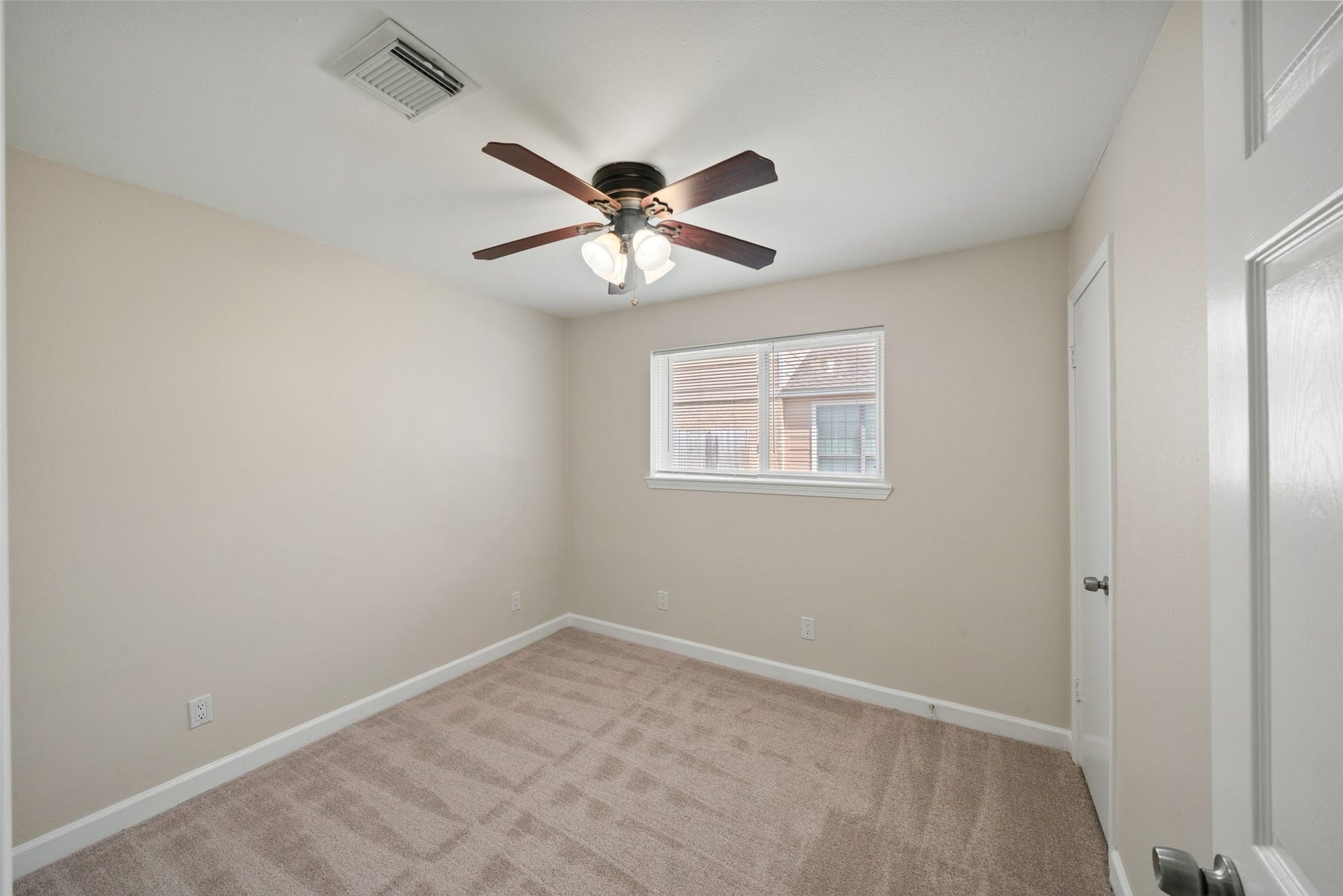 3402 Dovie Drive, Spring, TX 77380 Secondary Bedroom; new carpeting, mini blinds and fresh paint on walls and baseboards.