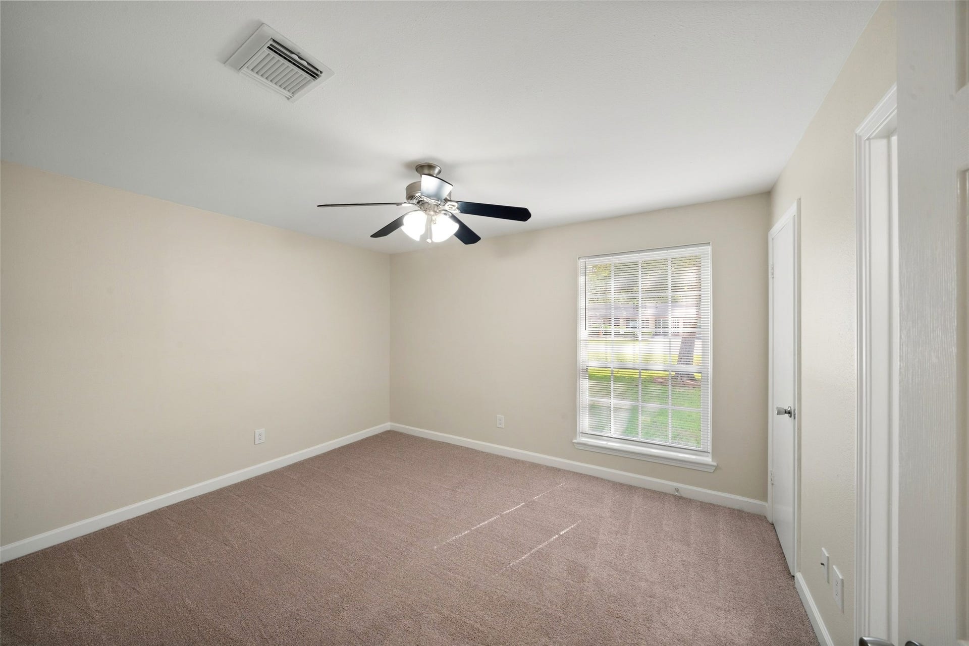 3402 Dovie Drive, Spring, TX 77380 Secondary Bedroom; new carpeting, mini blinds and fresh paint on walls and baseboards.
