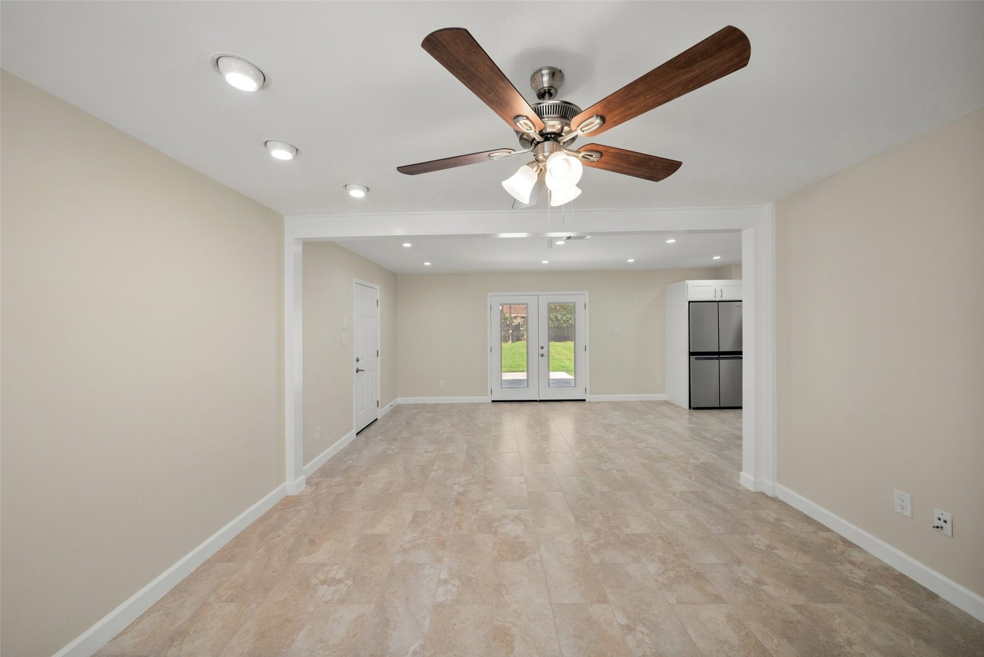 3402 Dovie Drive, Spring, TX 77380 This spacious dining area offers a bright, open layout with plenty of room for a full dining set and entertaining. The neutral finishes and recessed lighting create a clean, inviting atmosphere, while the double glass doors provide a direct view of the backyard and allow natural light to flow into the space. The open connection to the adjoining living area gives the room an easy, comfortable feel for everyday meals and gatherings.