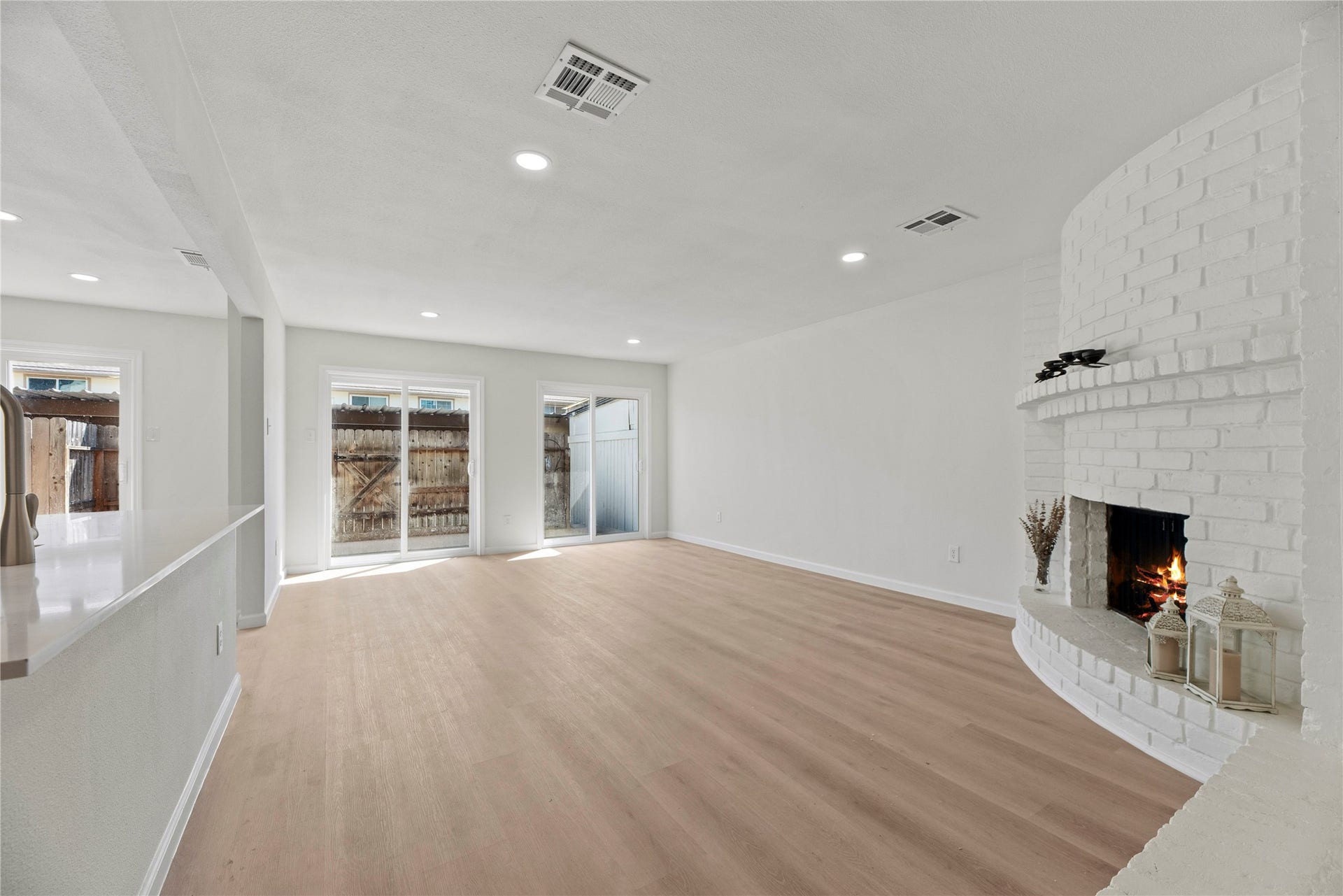 14249 Lost Meadow Lane, Houston, TX 77079 Back slidding doors and original brick fire place.
