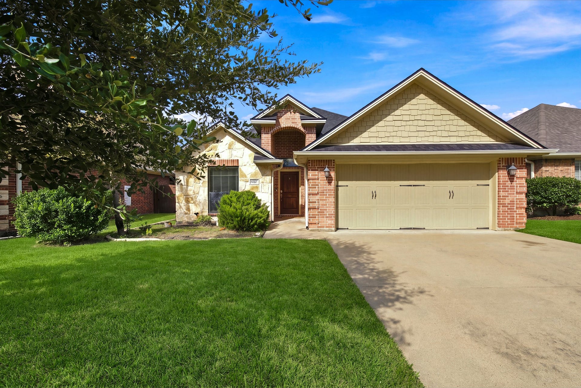 4267 Hollow Stone Drive, College Station, TX 77845 The grass has been digitally enhanced.