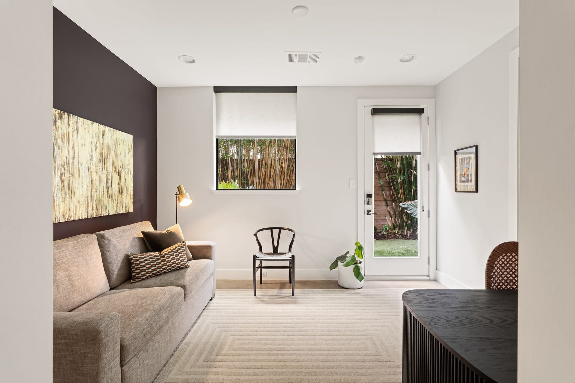 2622 Greenbriar Drive, Houston, TX 77098 Versatile first-floor bedroom with high ceilings and direct backyard access, currently styled as an office and lounge and equally suited for overnight guests.