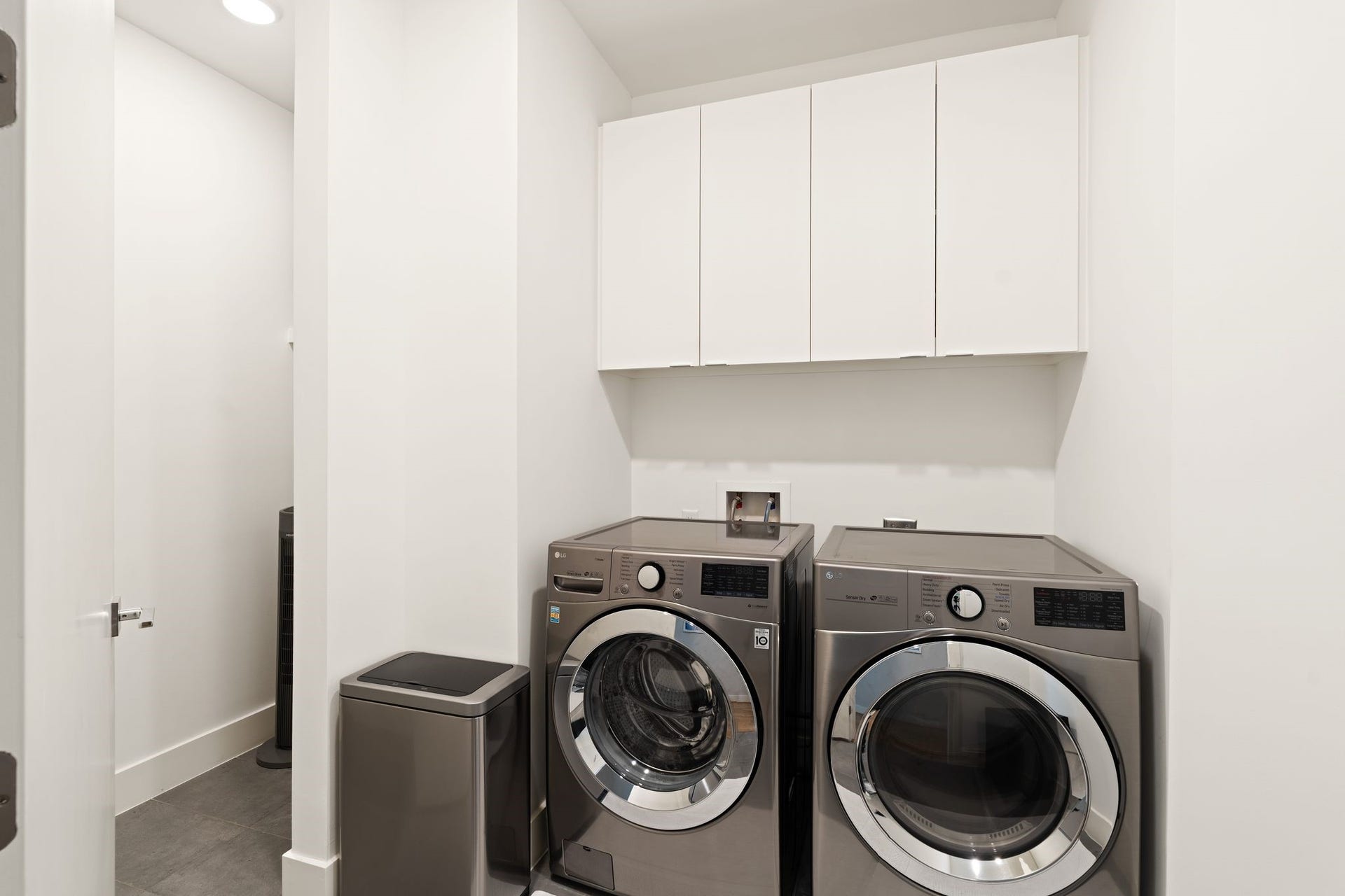 2622 Greenbriar Drive, Houston, TX 77098 Spacious third-floor utility room offers full-size laundry, extensive built-in cabinetry, additional storage, and the homes central audio/visual equipment, supporting integrated technology and enhanced whole-home Wi-Fi coverage.