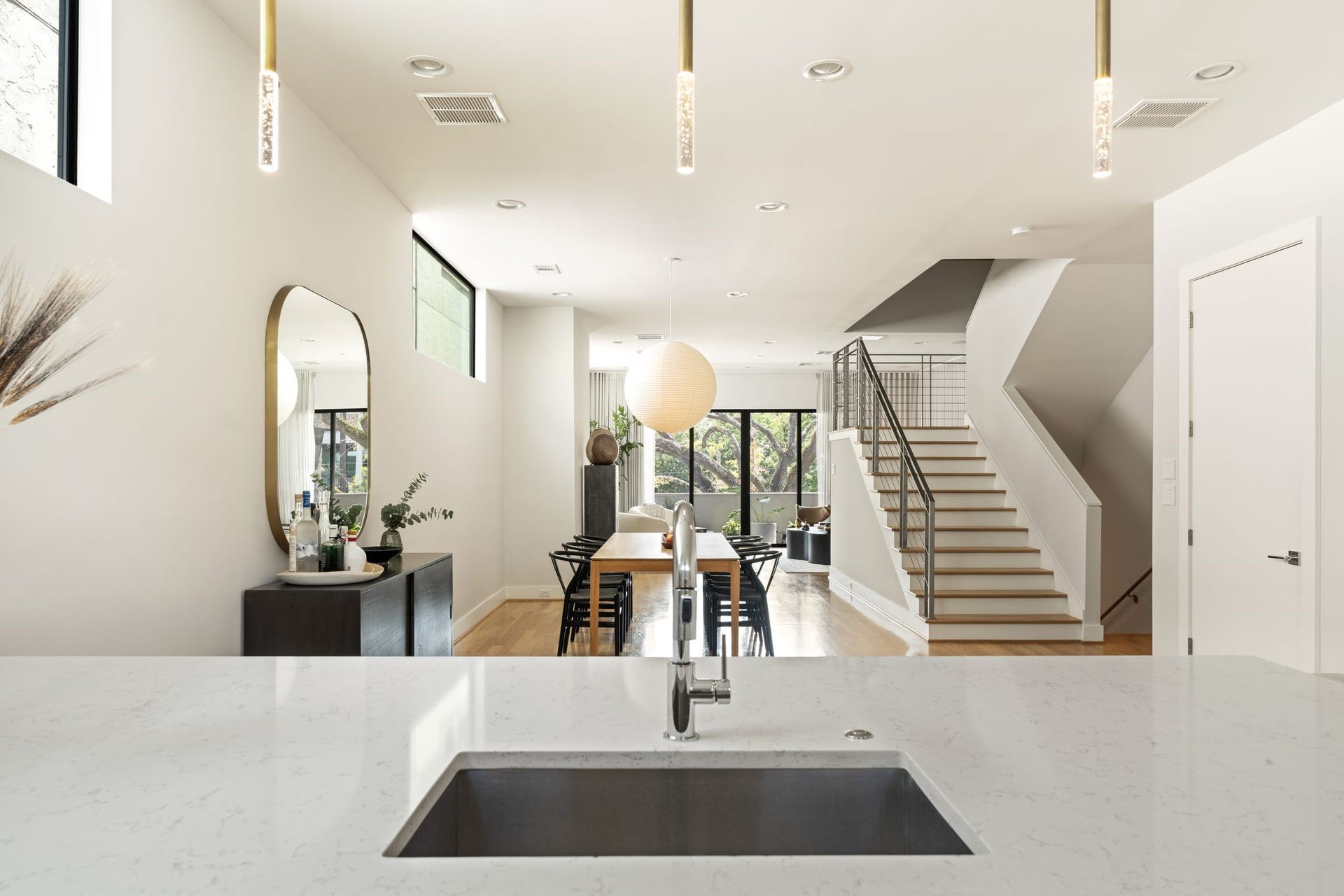 2622 Greenbriar Drive, Houston, TX 77098 View from the kitchen illustrates the effortless open-concept flow through the dining area to the light-filled living room beyond.