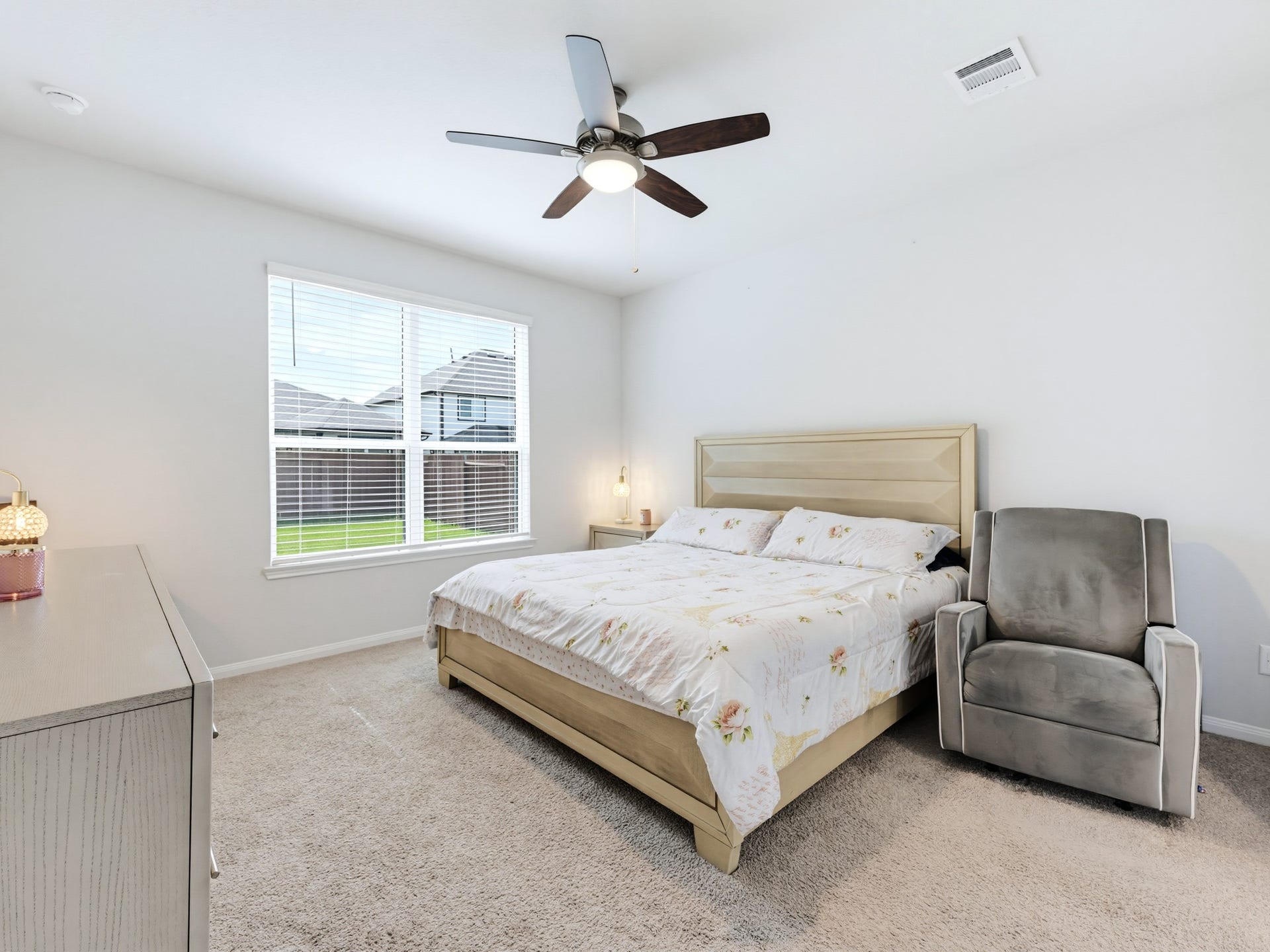 The spacious primary bedroom is conveniently located on the first floor.