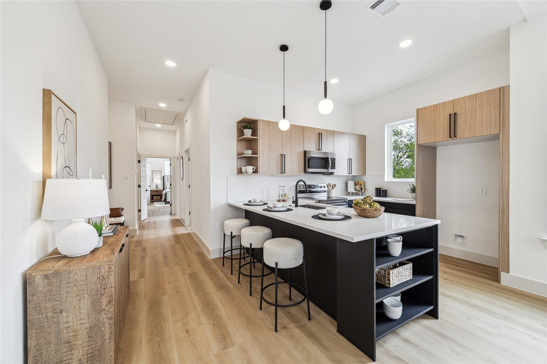 4415 Buck Street, #A/B, Houston, TX 77020 Built in shelving providing additional storage and a stylish focal point for the space.