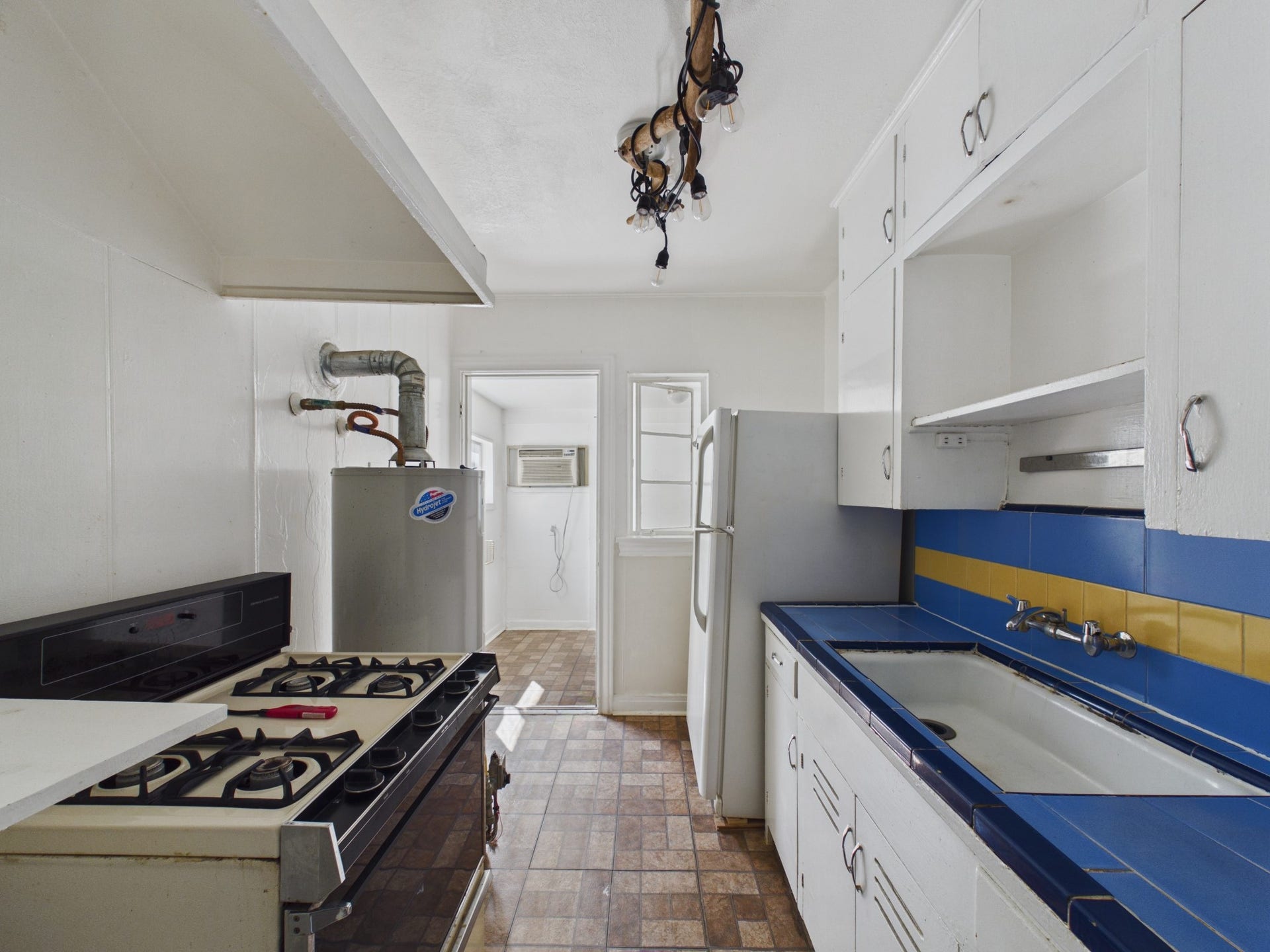 Gas Range, Large Sink & Refrigerator