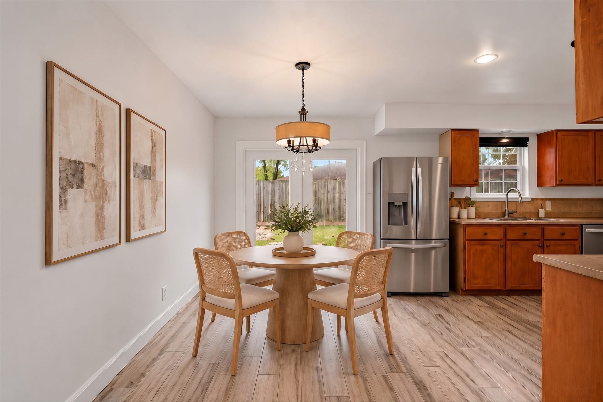 22711 Provincial Boulevard, Katy, TX 77450 Virtually Staged: Bright and comfortable, this open breakfast nook balances functional dining space with delightful backyard views.