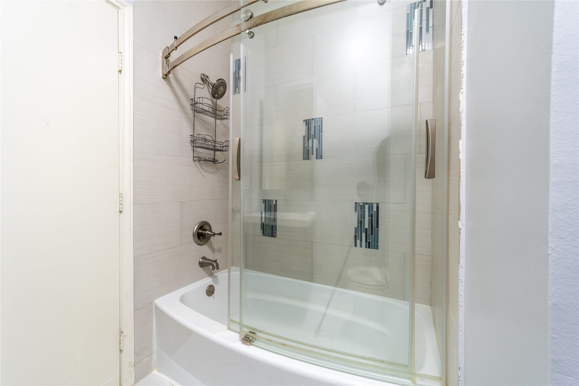 7332 Regency Square Court, #7332, Houston, TX 77036 Updated bathroom with a glass-enclosed tub and shower