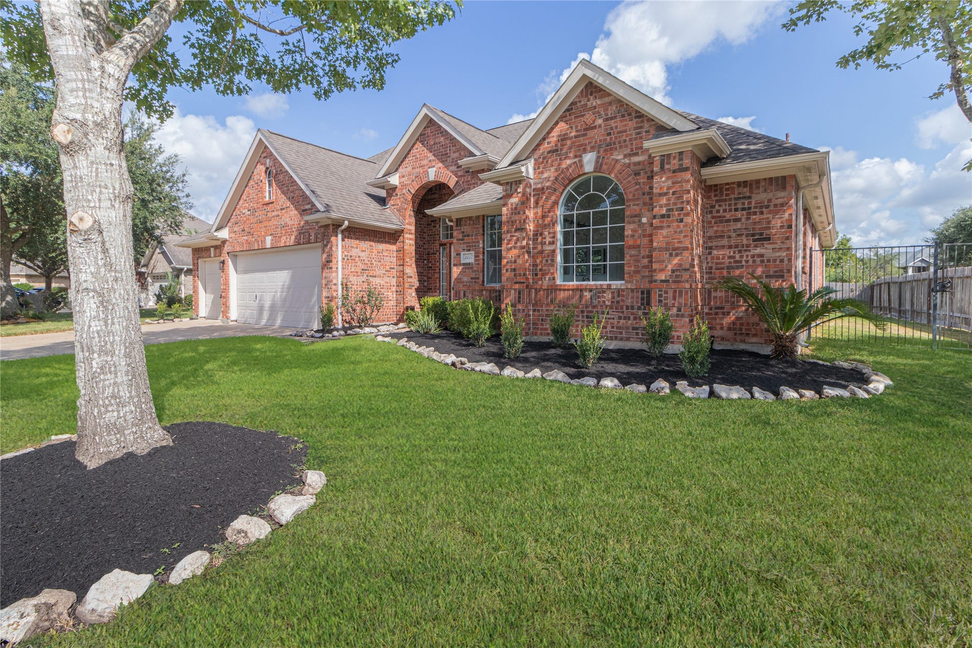 3115 Hickory Grove Lane, Pearland, TX 77584 Updated landscaping with mature trees in the yard.