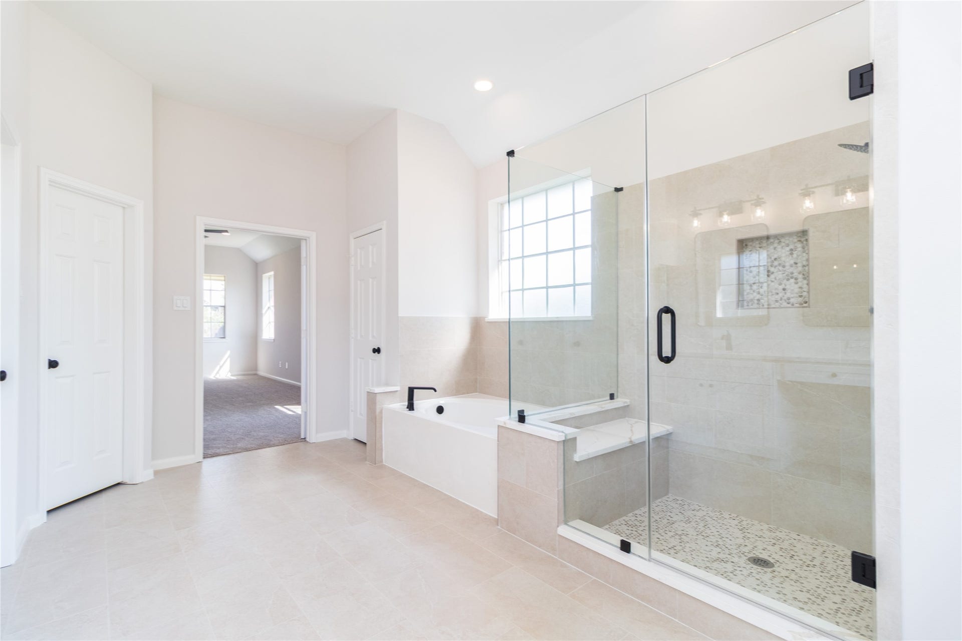 3115 Hickory Grove Lane, Pearland, TX 77584 The primary bath was completely updated with new shower glass, tile, fixtures, cabinets, quartz tops, mirrors, and more.