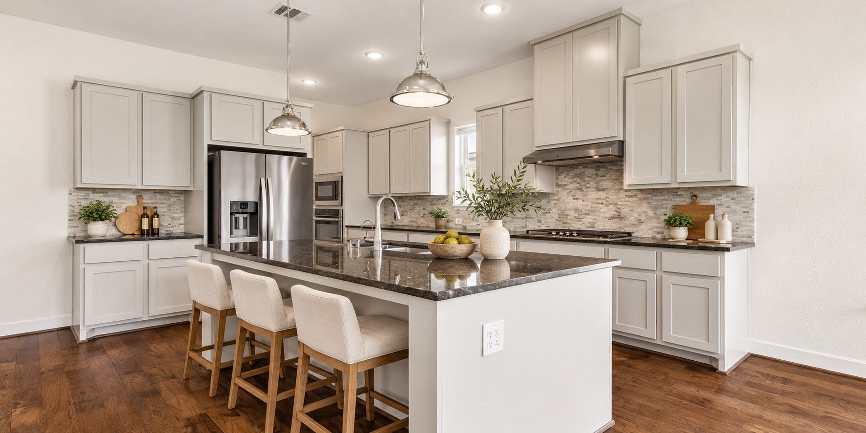 6 Clearview Terrace Place, Tomball, TX 77375 Bright kitchen with seating area and stainless steel appliances, and ample cabinet space.