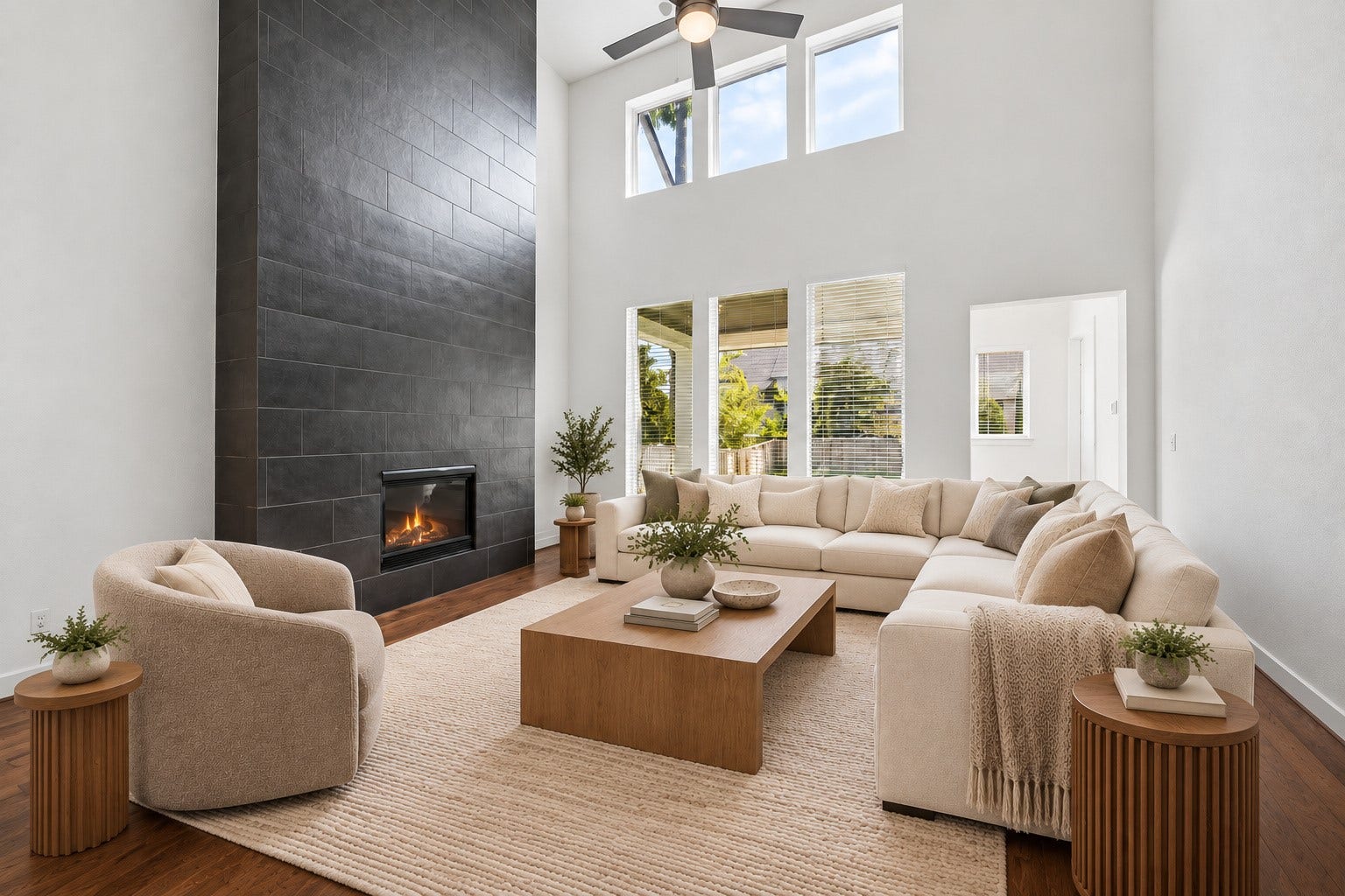 6 Clearview Terrace Place, Tomball, TX 77375 Spacious living room with soaring ceilings and a striking floor to ceiling fireplace.