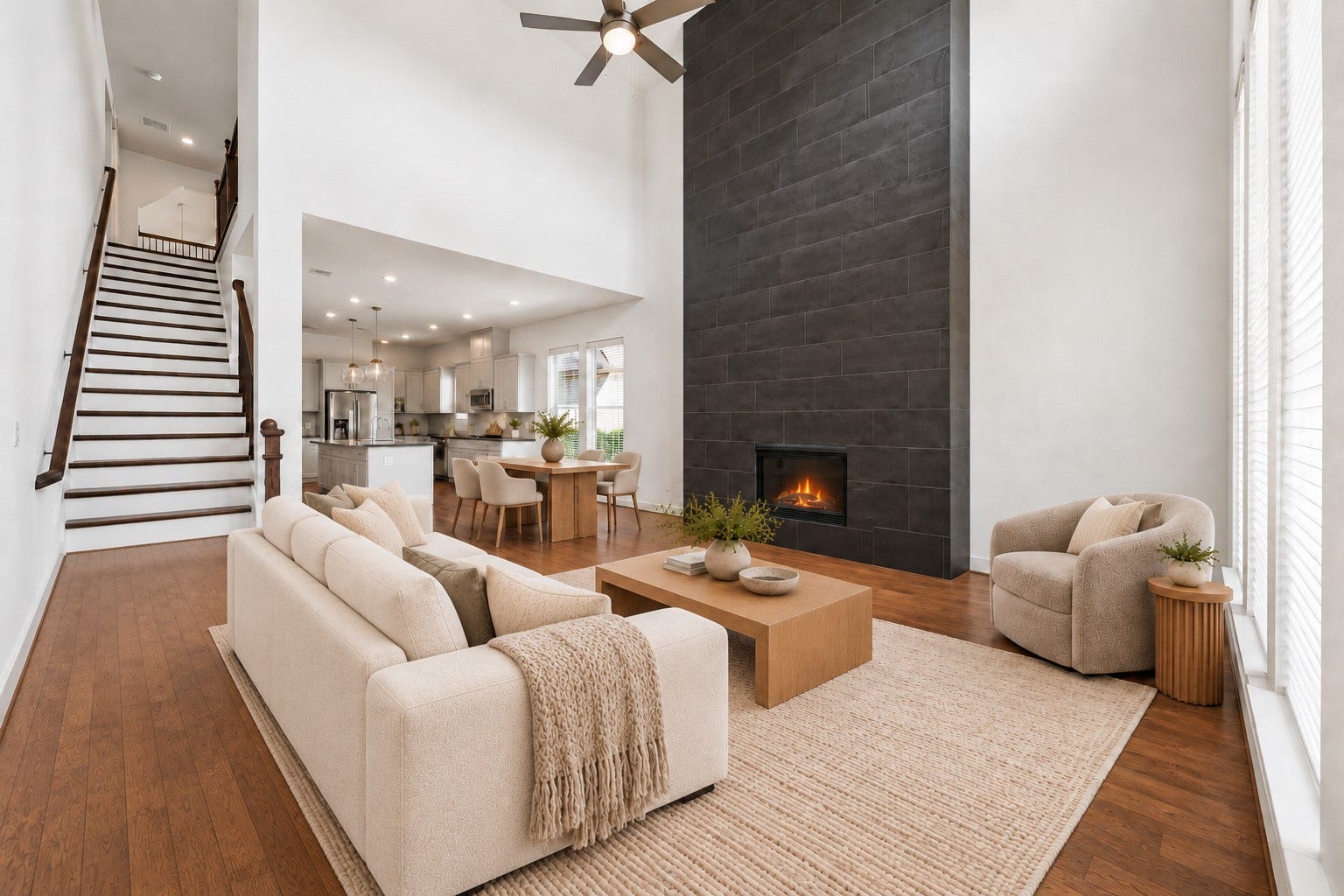 6 Clearview Terrace Place, Tomball, TX 77375 Living room showcasing the soaring ceiling, and open view to the kitchen and dining area.