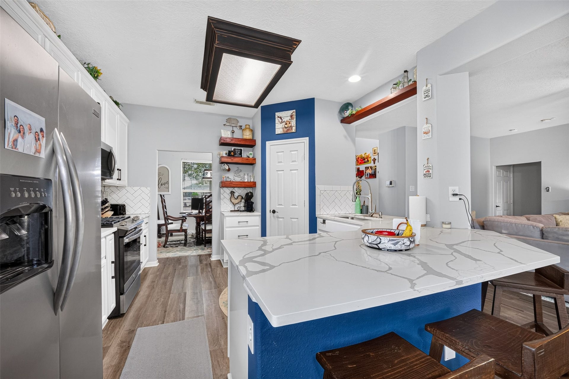 113 Erin Court, La Porte, TX 77571 Island kitchen with bar seating, open to the living room.