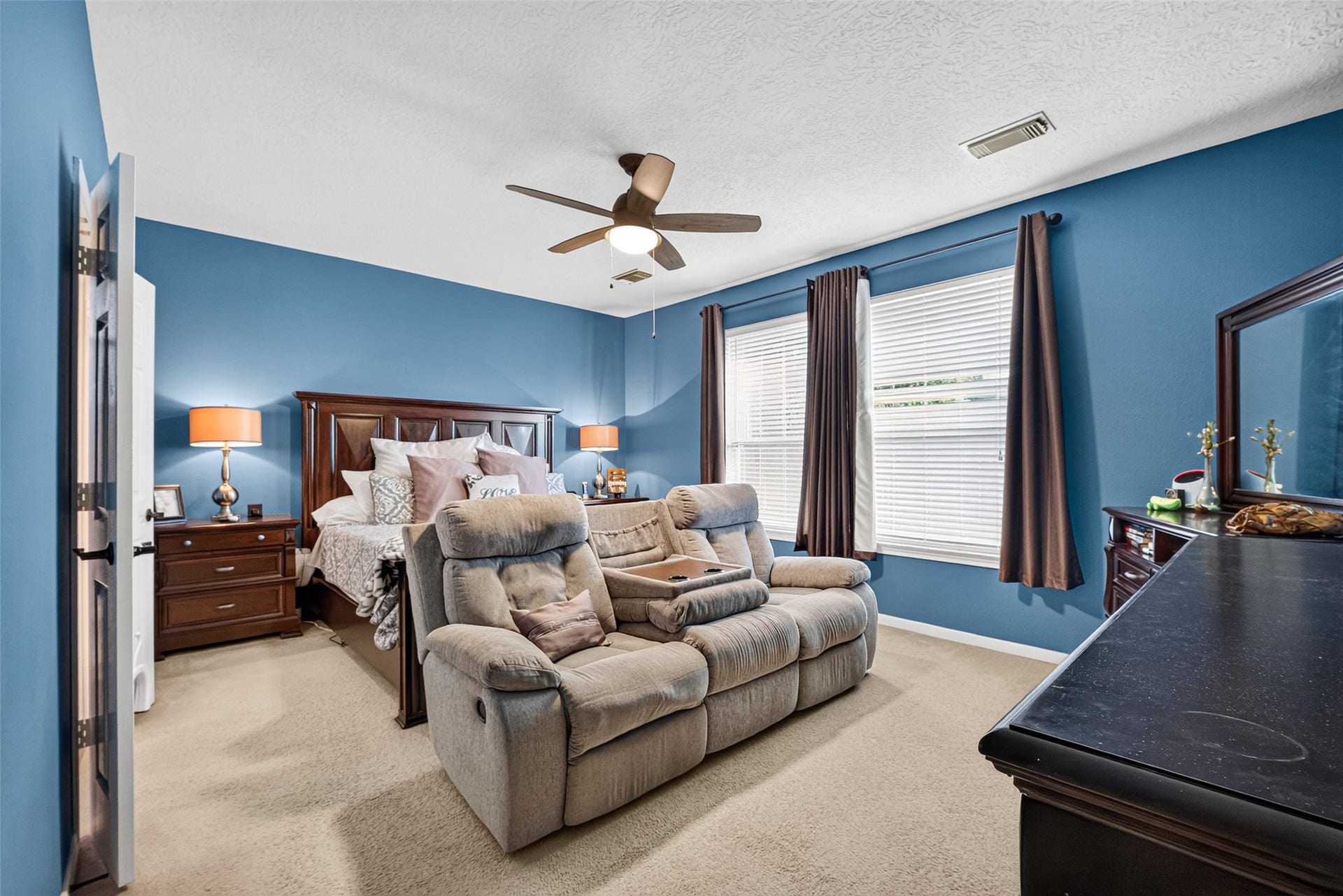113 Erin Court, La Porte, TX 77571 Relaxing primary suite with sitting area and large windows.
