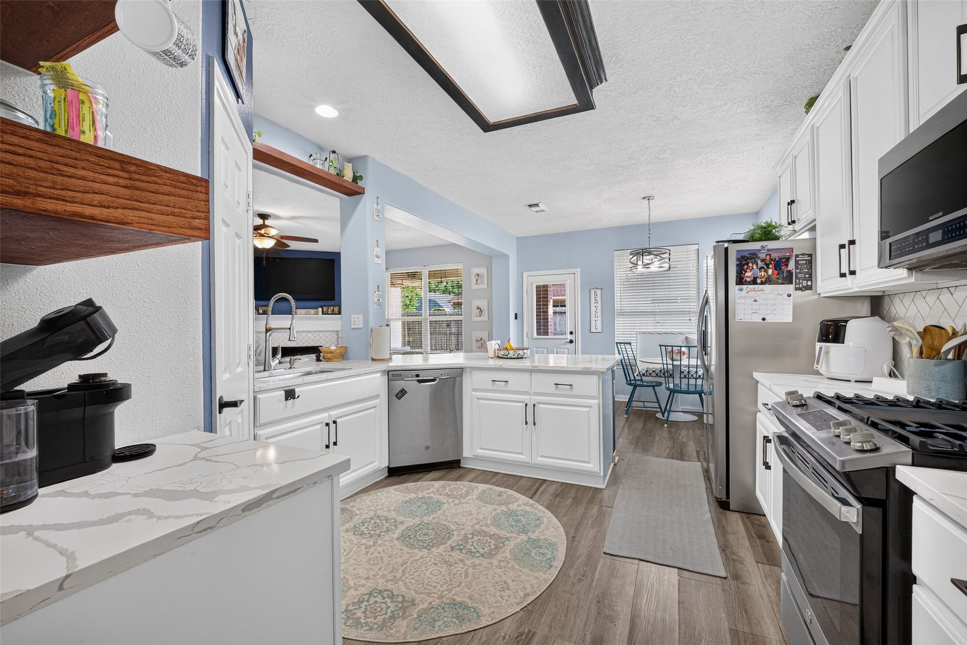 113 Erin Court, La Porte, TX 77571 Kitchen with a roomy island at its center the heart of the home.