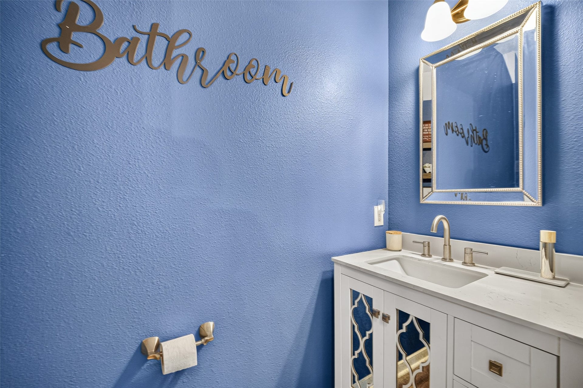 113 Erin Court, La Porte, TX 77571 Convenient powder room with bold blue walls.