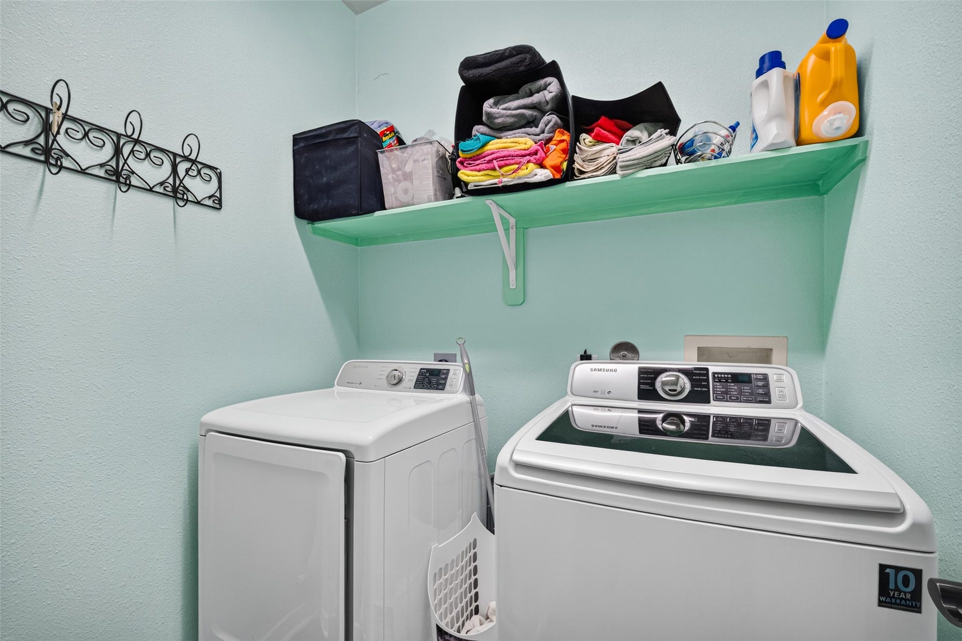 113 Erin Court, La Porte, TX 77571 Indoor laundry room with built-in storage shelving.