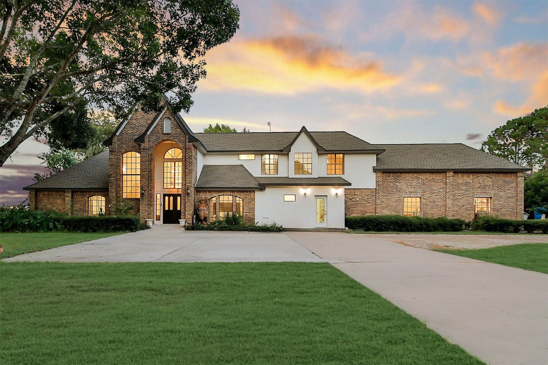 11 W Kitty Hawk ST, Richmond, TX 77406 Distinctive estate residence offering an impressive arrival, expansive driveway and beautifully framed front elevation