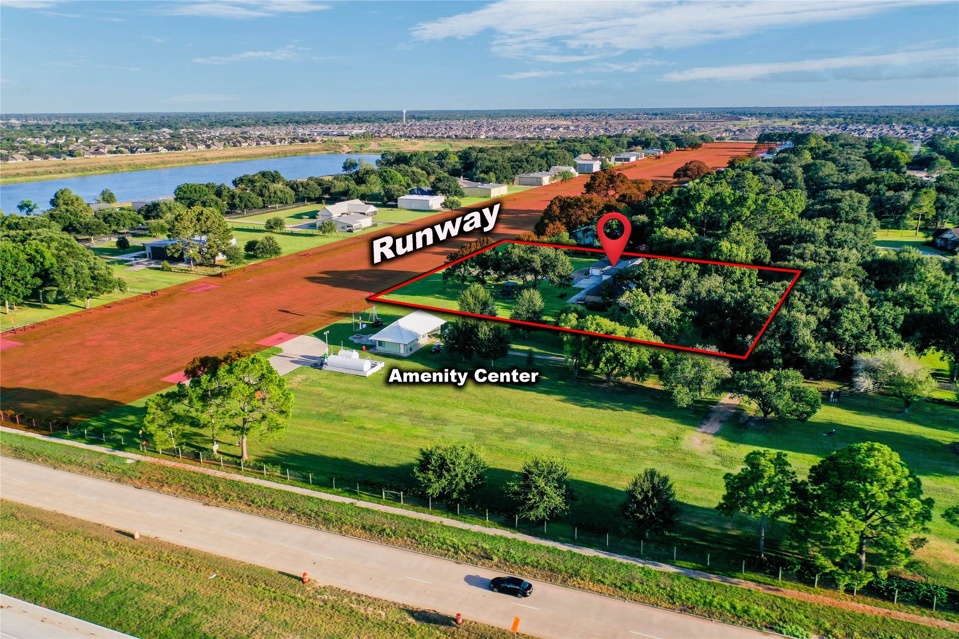 11 W Kitty Hawk ST, Richmond, TX 77406 Aviation lifestyle from your backyardan aerial perspective highlighting the propertys relationship to the runway and community amenity center.