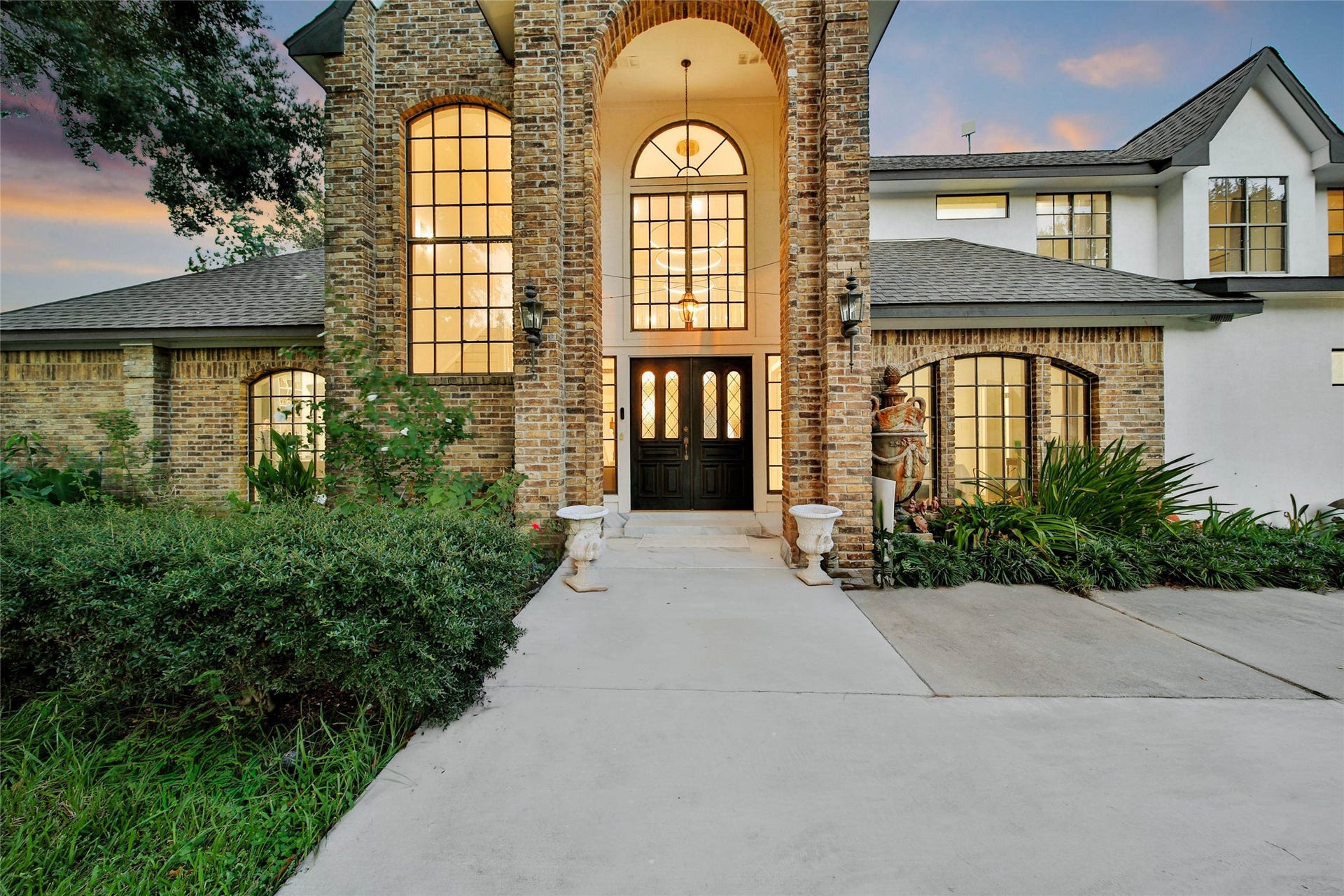 11 W Kitty Hawk ST, Richmond, TX 77406 Grand covered entry with soaring architectural details creates an impressive welcome