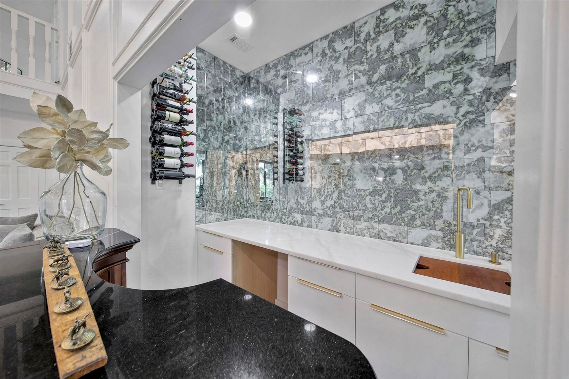 11 W Kitty Hawk ST, Richmond, TX 77406 Beautifully appointed entertaining area with extensive cabinetry, display storage and beverage-serving space, wet bar