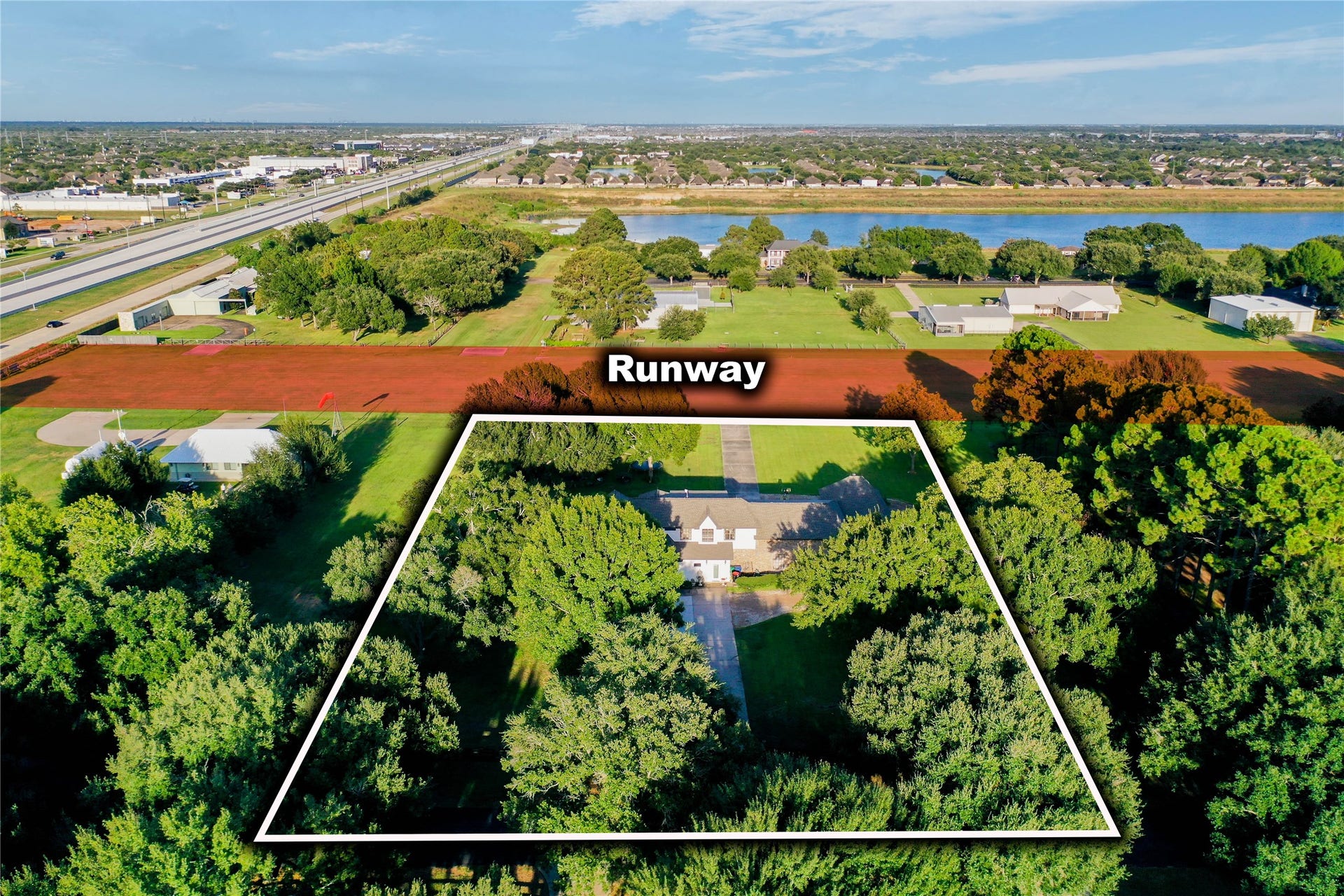 11 W Kitty Hawk ST, Richmond, TX 77406 Aerial view defines the property setting while illustrating its immediate relationship to the community runway.