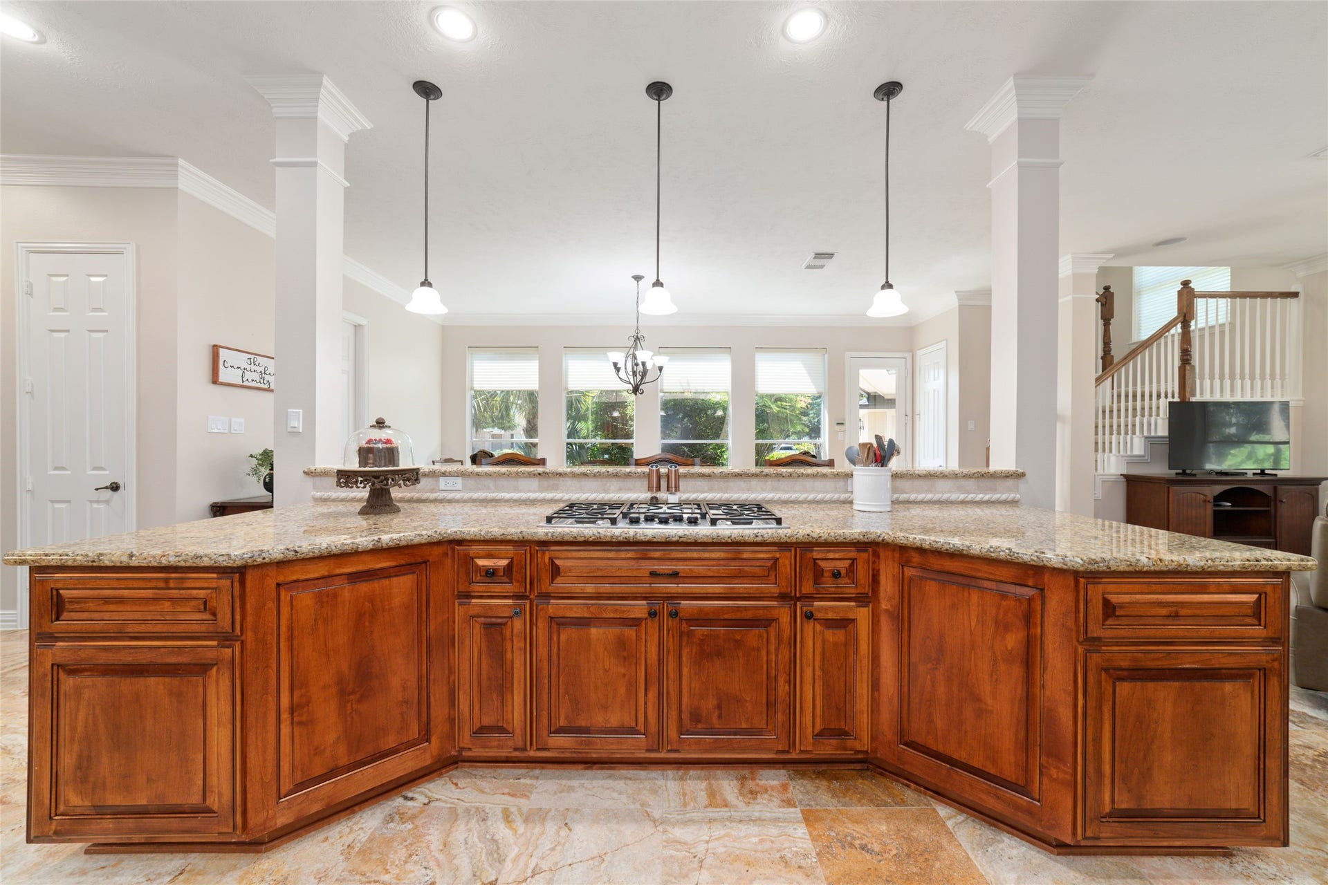 Granite countertop featuring a built-in cooktop.