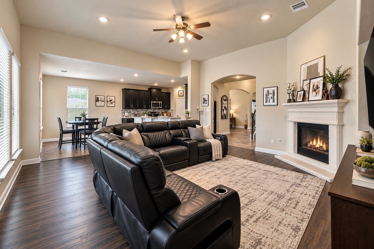 Gatherings in this space is a dream! Arched doorways and a cozy fireplace completes your living room, and the size is perfect for entertaining and relaxing!