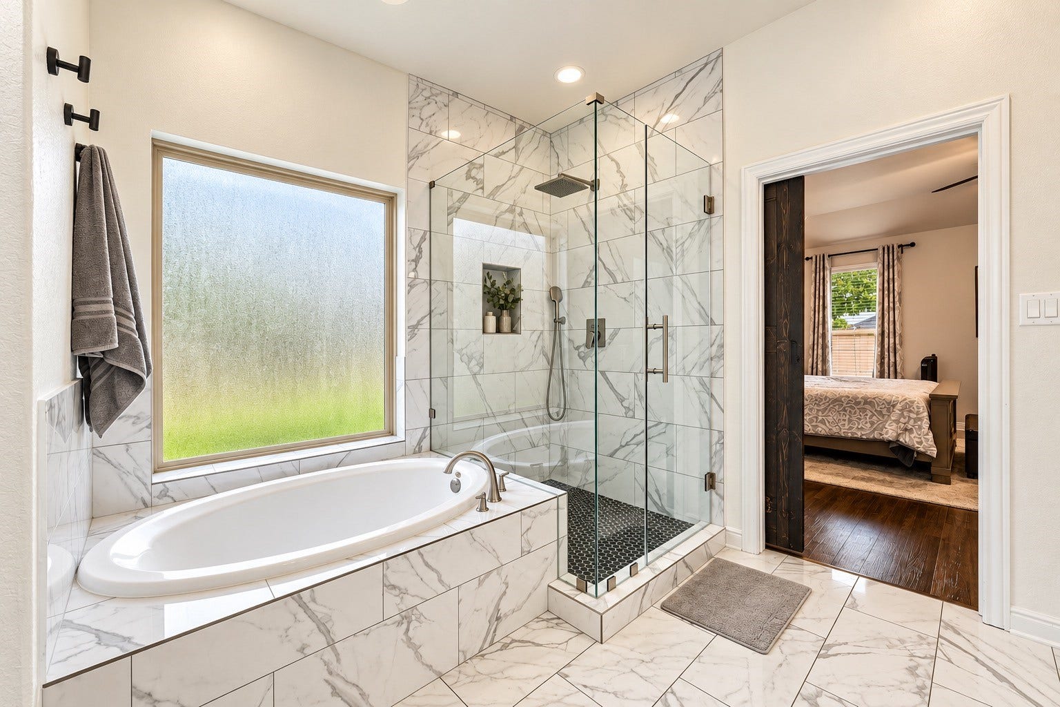No expense was spared in this en-suite! A luxurious framless shower, seperate soaking tub, and updated tile flooring and backsplash were also added to complete this space!
