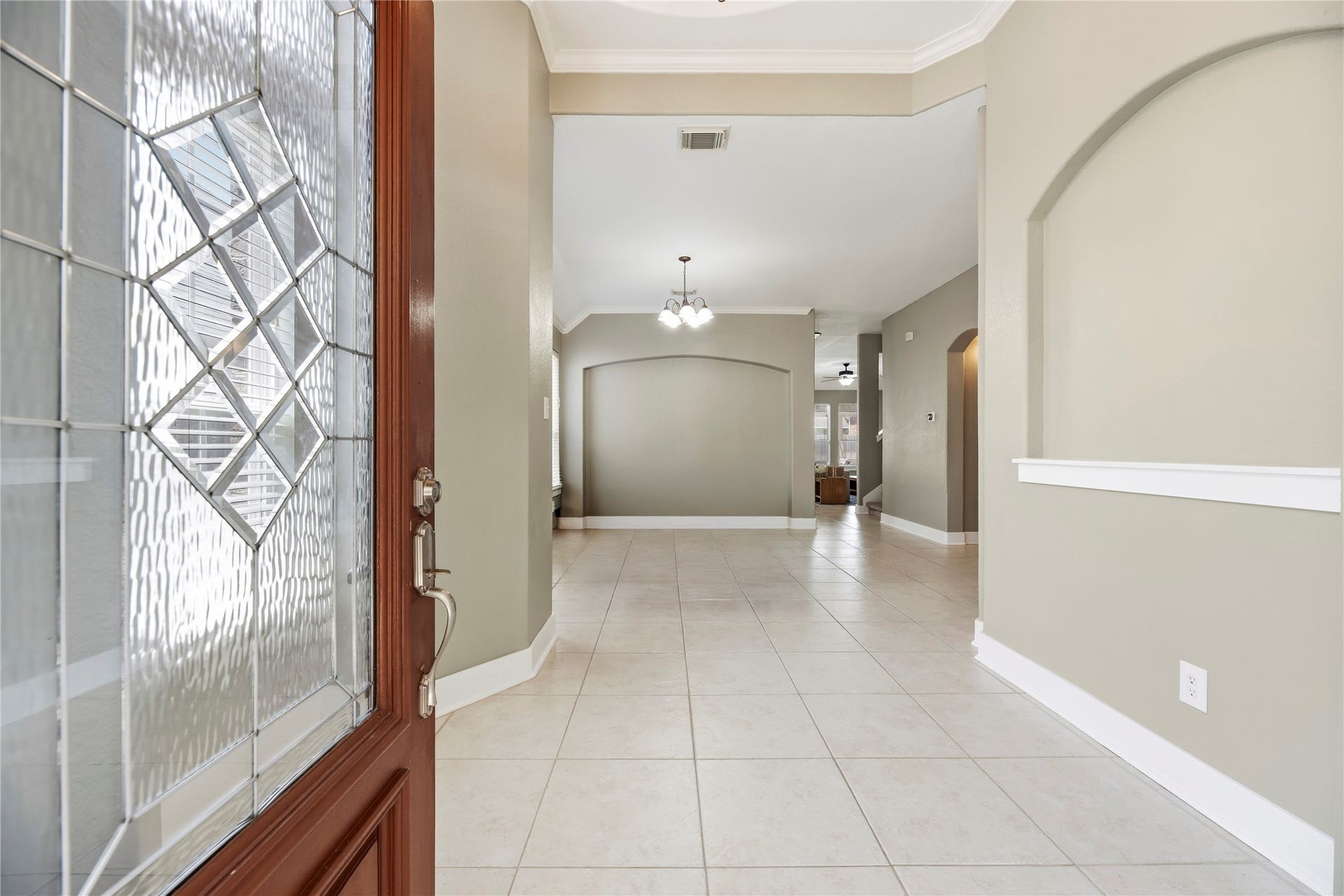 20918 Field Manor Lane, Katy, TX 77450 Step inside and be welcomed by a grand entrance that opens beautifully into the elegant formal dining area.
