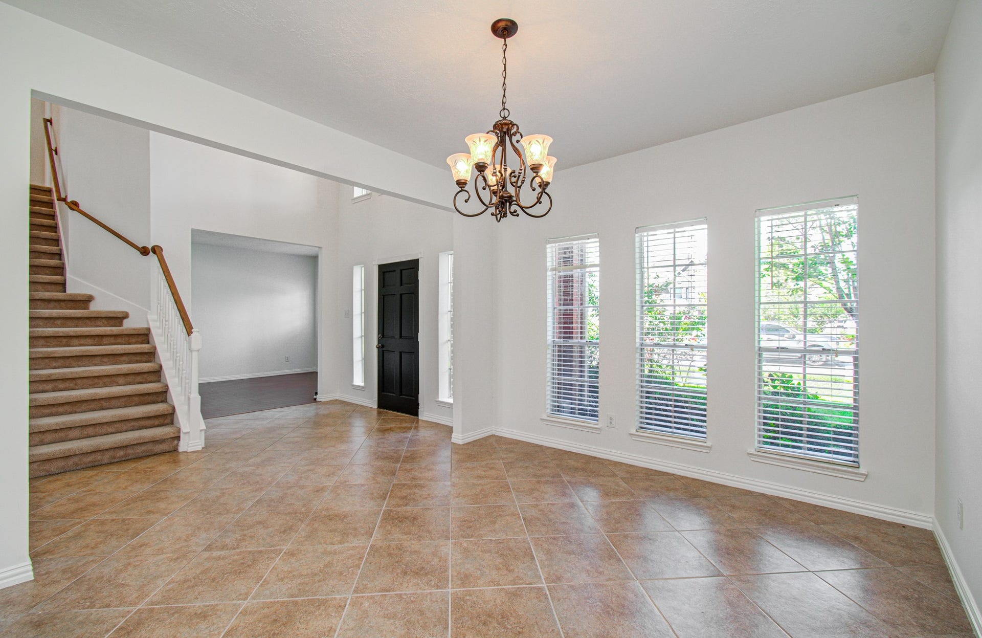 1402 Pine Knot Court, Pearland, TX 77581 Formal dining room with 3 windows providing natural light.