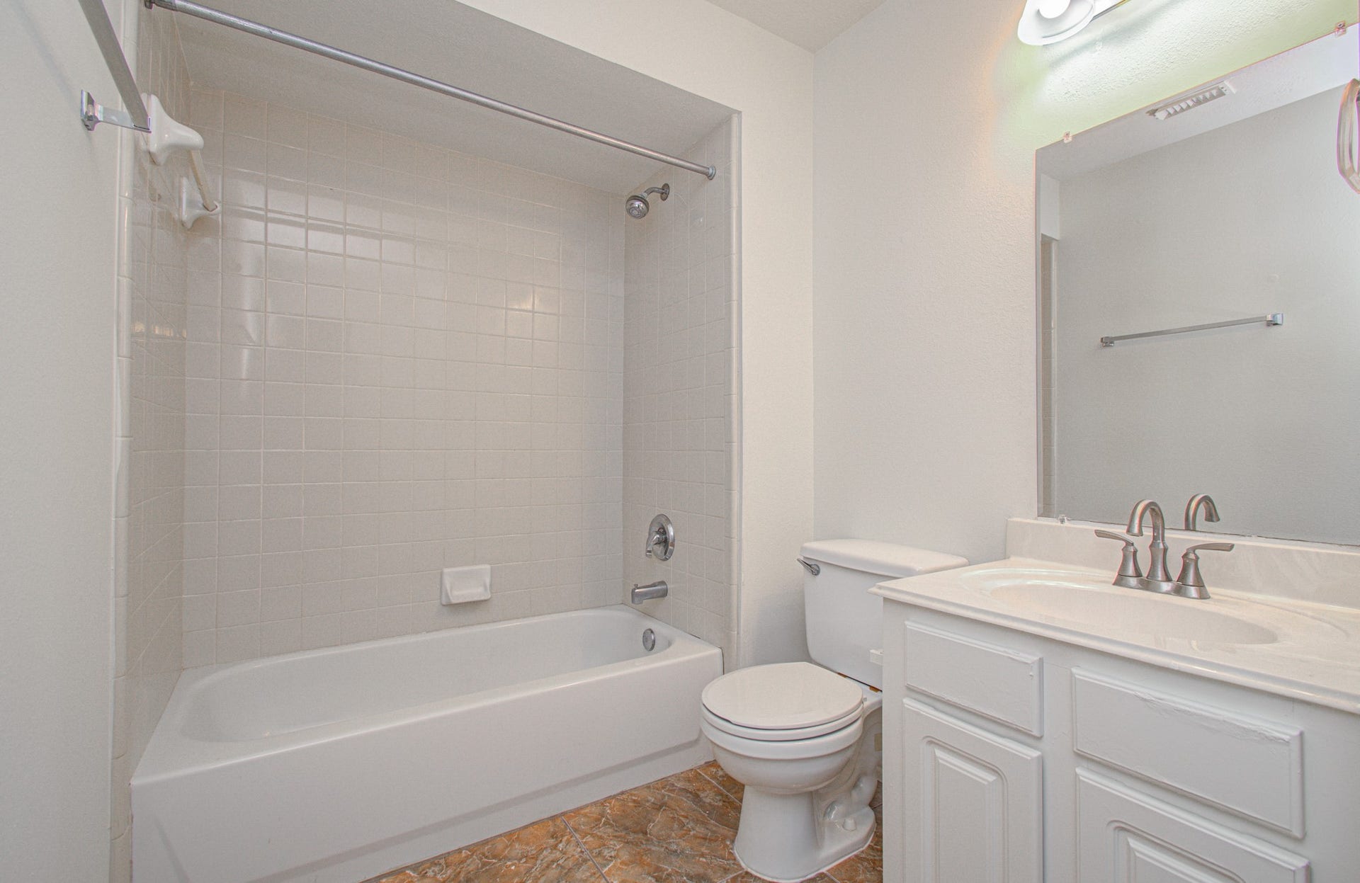 1402 Pine Knot Court, Pearland, TX 77581 One of the two full bathrooms upstairs. Shower/tub combo in both.